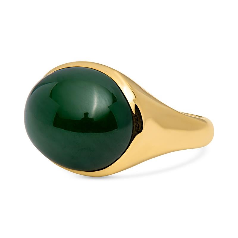 A beautiful and unique ring from Elsa Peretti for Tiffany & Co., this ring features an oval cut jade cabochon bezel set in an 18 karat yellow gold polished gold surround. Signed Tiffany & Co. Elsa Peretti Hong Kong. This ring is a size 8 but can be