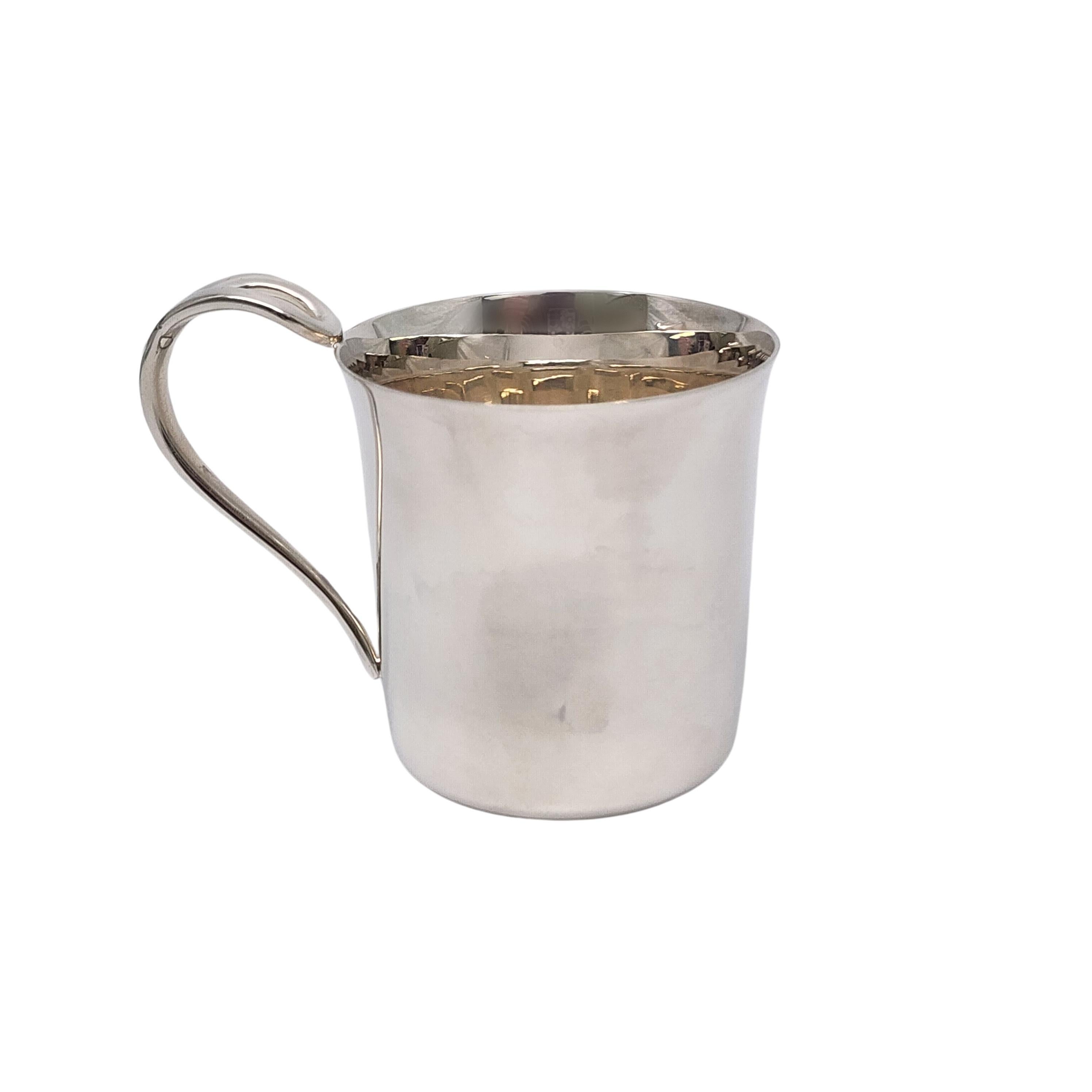 Tiffany & Co sterling silver baby cup in the Padova pattern by Elsa Peretti with pouch.

No monogram

A simple and classic child or baby cup with a curved open loop handle and highly polished finish. Includes Tiffany & Co pouch.

Measures approx 2