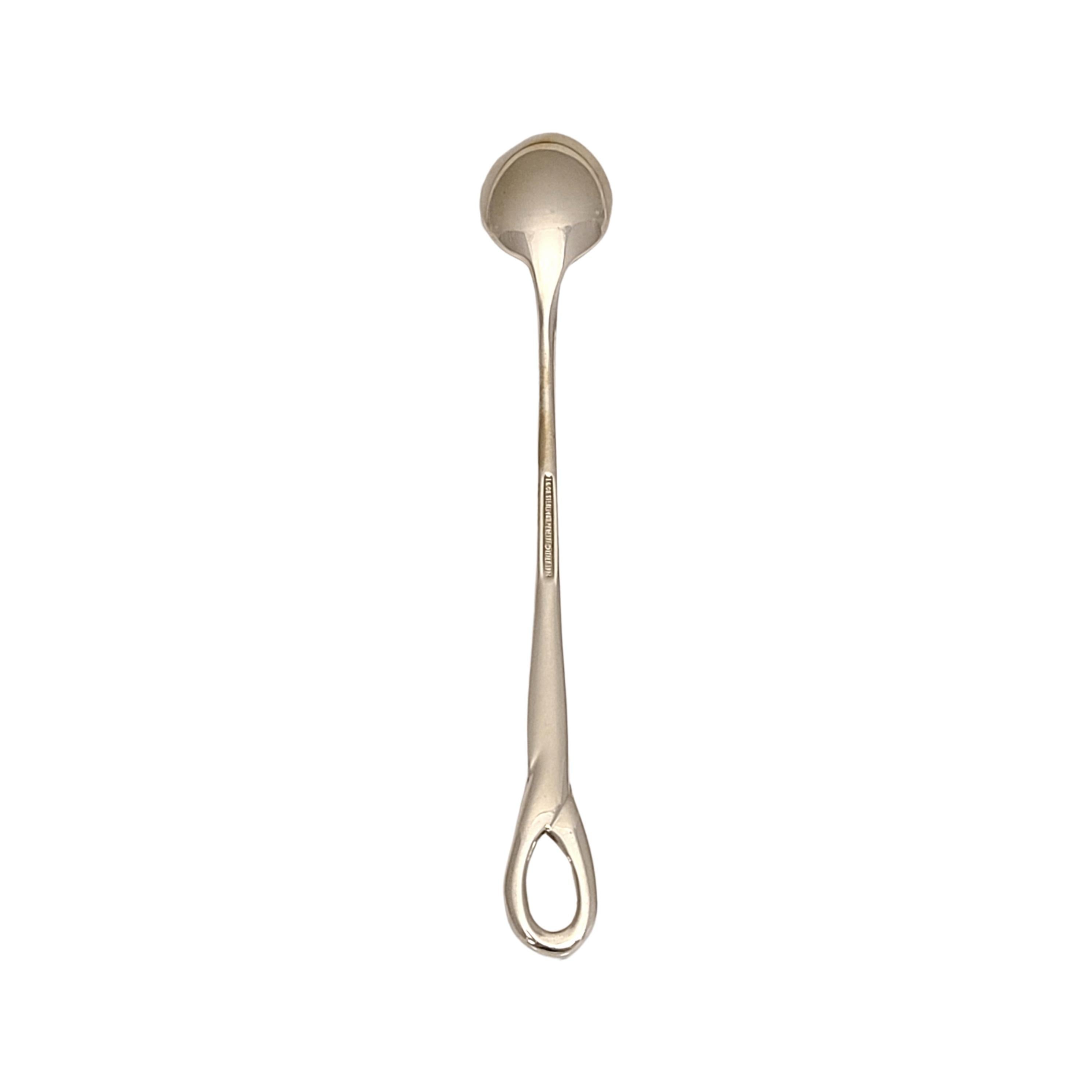 Tiffany & Co sterling silver baby feeding spoon in the Padova pattern by Elsa Peretti.

Monogram appears to be C

Padova is a simple and classic design featuring a loop at the top of the handle, named for the Italian city in which it was created in.