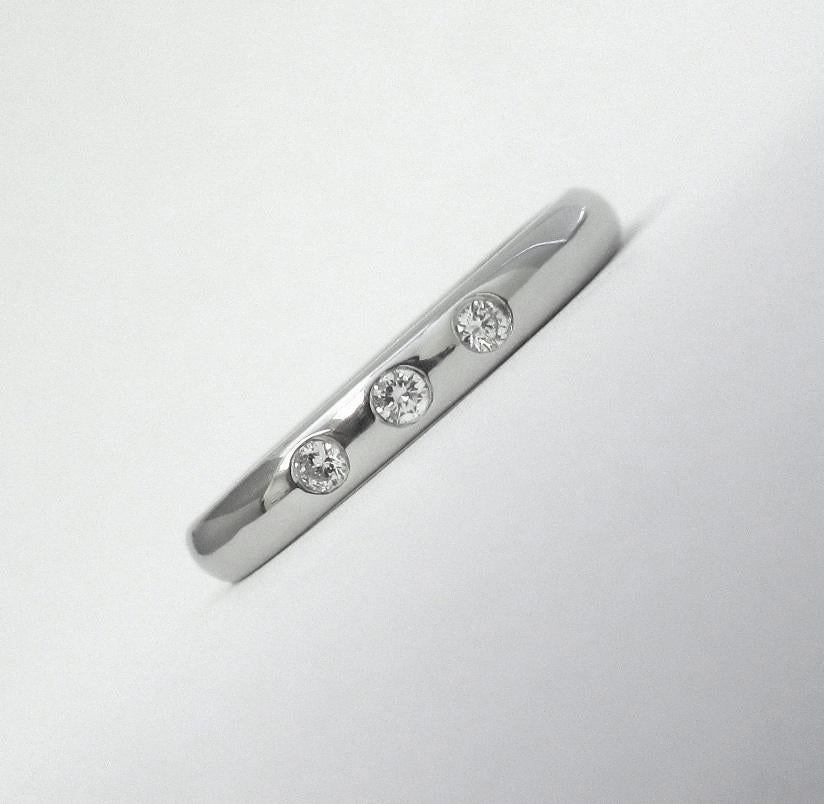 TIFFANY & Co. Elsa Peretti Platinum .06ct Diamond Stacking Band Ring 5

 Metal: Platinum
 Sizes: 5 
 Band Width: 2.7mm
 Weight: 5.10 grams 
 Diamond: 3 round brilliant diamonds, carat total weight .06 
 Hallmark: TIFFANY&Co. ©PERETTI PT950 SPAIN 
