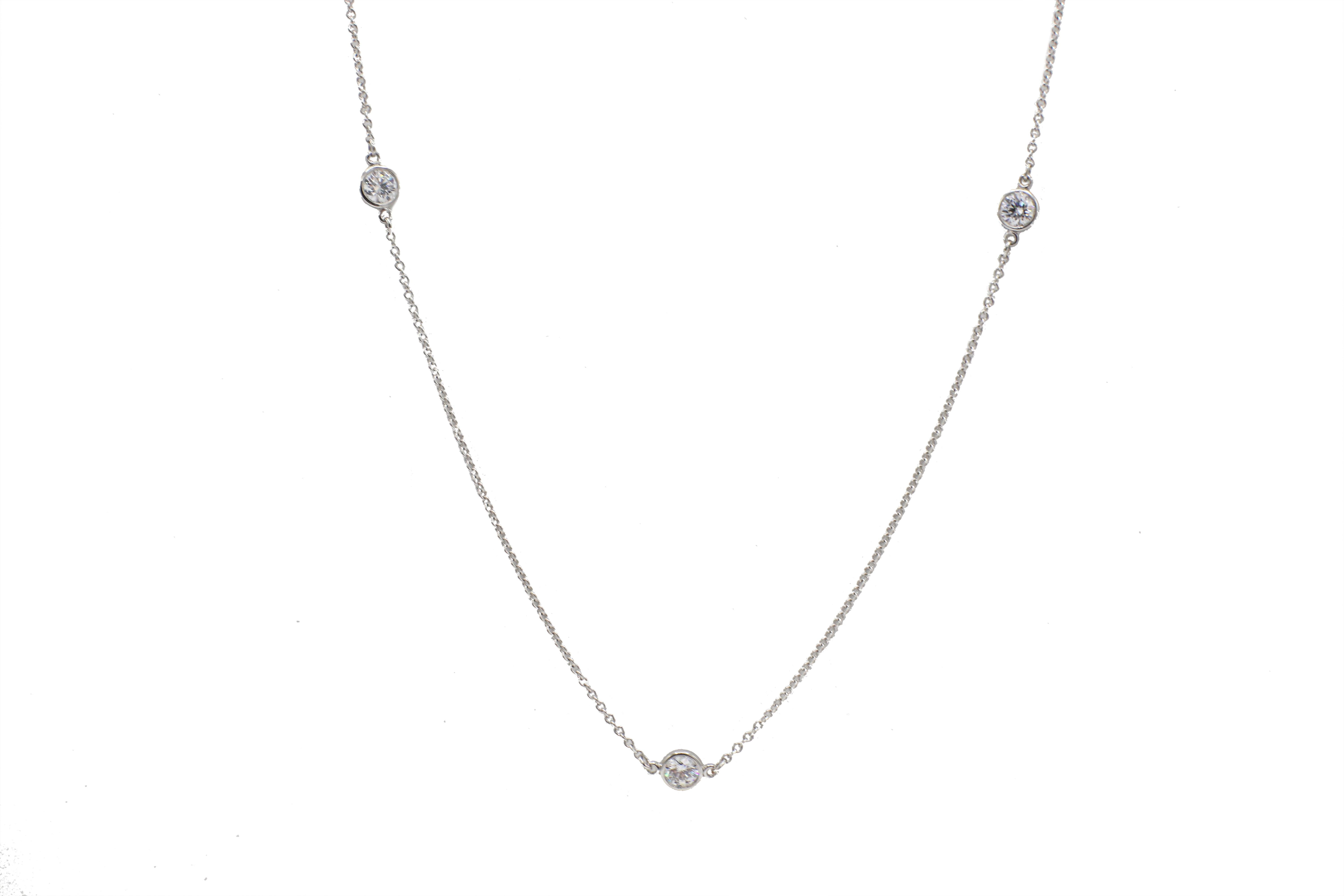 Tiffany & Co. Elsa Peretti Platinum 5 Diamond By The Yard .90 Carat Necklace 
Metal: Platinum
Weight: 3.02 grams
Diamonds: Approx. .90 CTW F-G VS
Length: 16 inches
Retail: $7,700 USD
