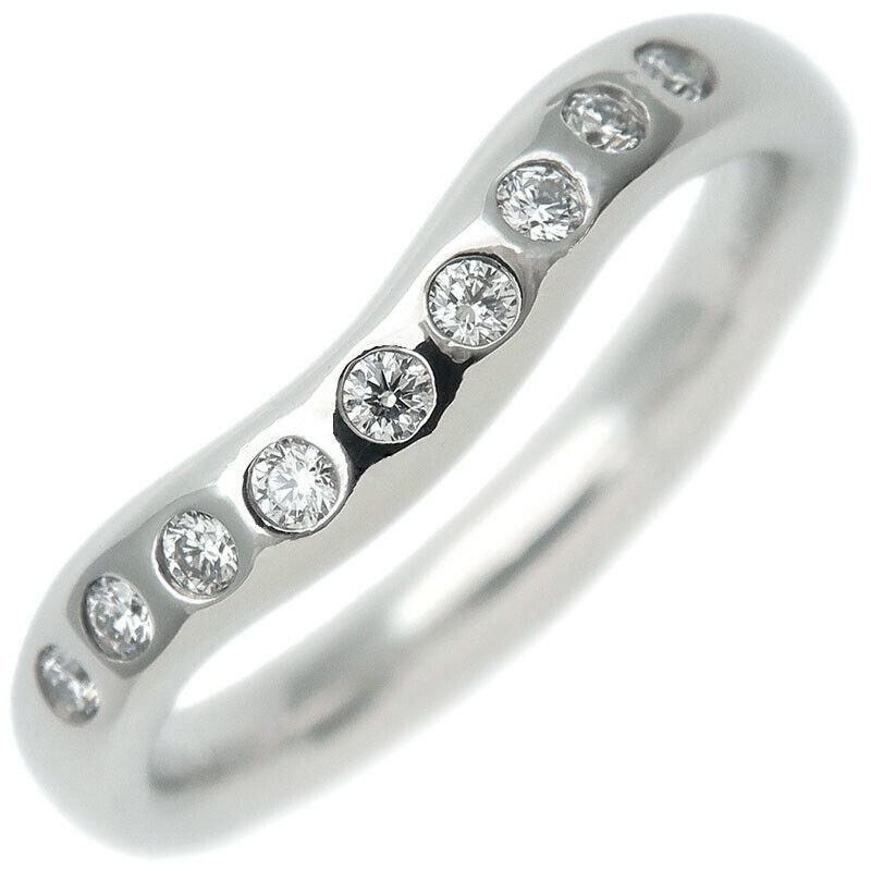 TIFFANY & Co. Elsa Peretti Platinum Diamond 3mm Curved Band Ring 4.5

Metal: Platinum
Size: 4.5
Weight: 5.0 grams
Width: 3mm
Diamond: Nine round brilliant diamonds, carat total weight .10 
Hallmarked: ©PERETTI SPAIN TIFFANY&CO. PT950
Condition: