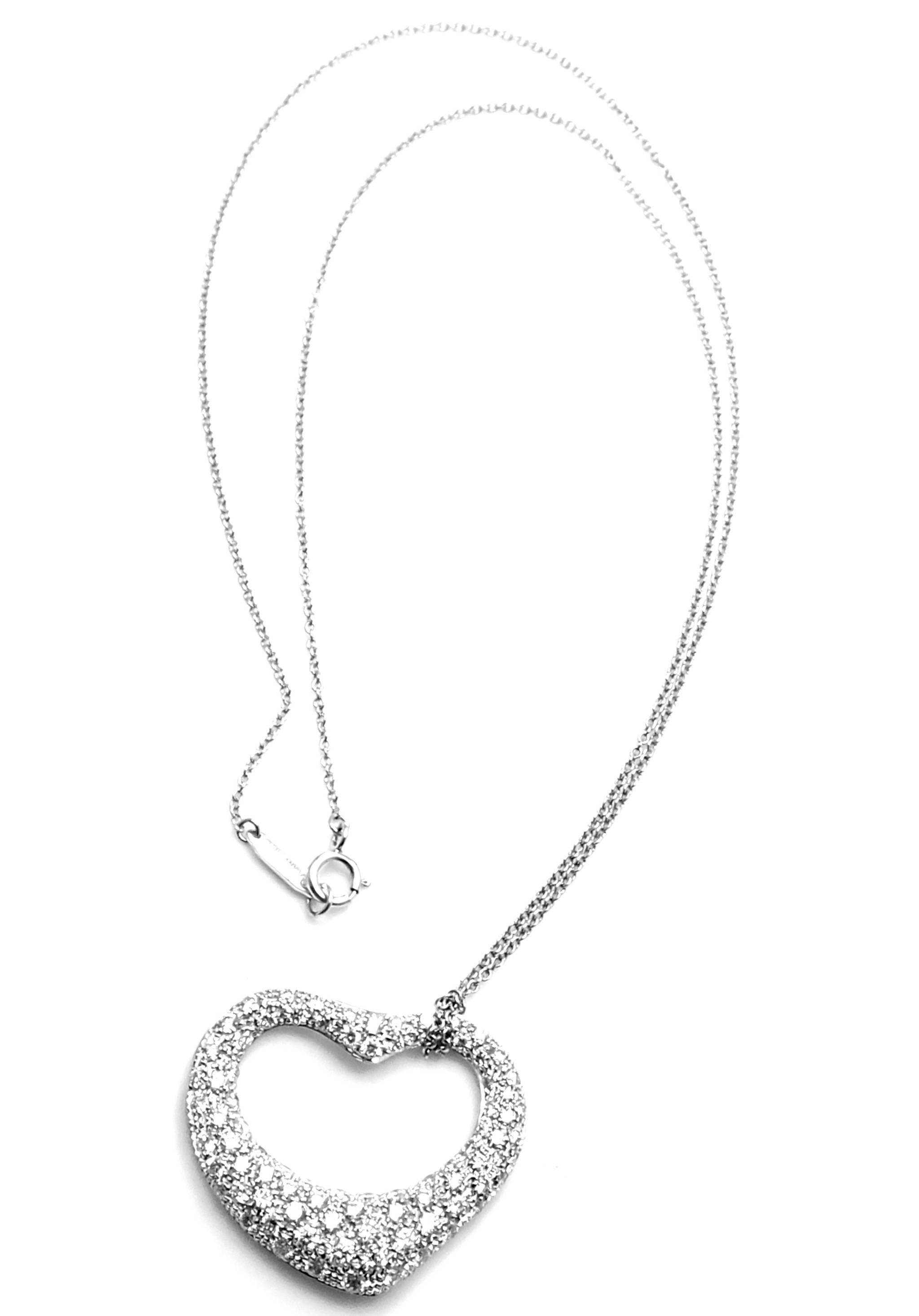 Platinum Diamond Open Heart Pendant Necklace by Elsa Peretti for Tiffany & Co.
With Round brilliant cut diamonds VS1 clarity, G color total weight approx. 2ct
This necklace comes with Tiffany & Co. box.
Details:
Length: 16.5