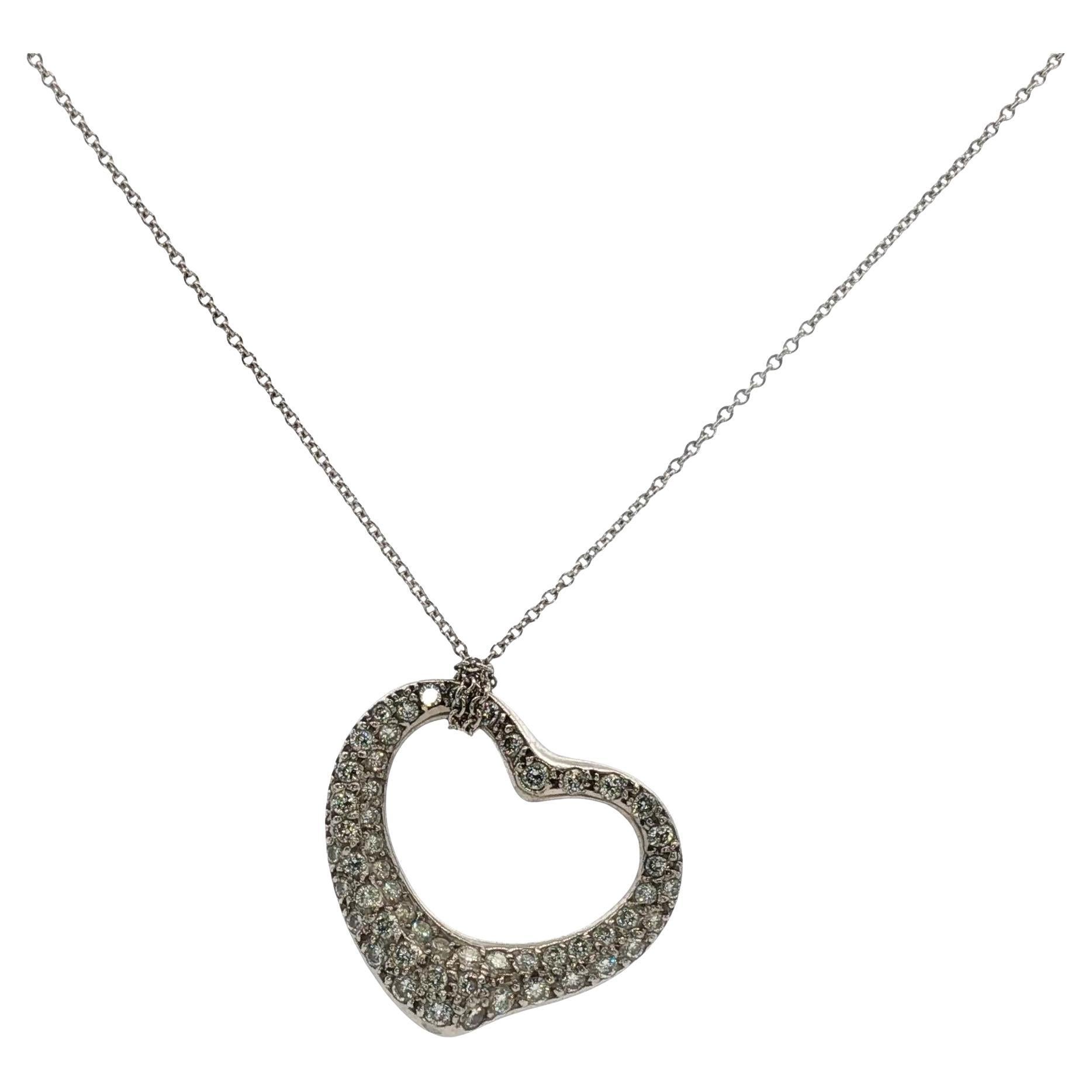 Tiffany 
Co. Collana con ciondolo a cuore aperto in platino con pavé di diamanti Elsa Peretti