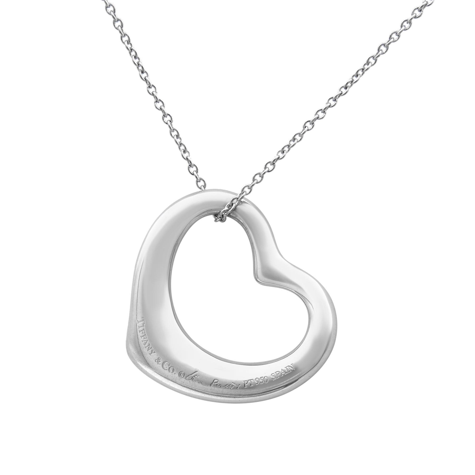 Tiffany & Co platinum with pavé diamonds heart shape pendant from Elsa Peretti collection. Open Heart designs celebrates the spirit of love. Dazzling diamonds accentuate the beautiful curves of this pendant. Totaling with 0.95cts of round cut