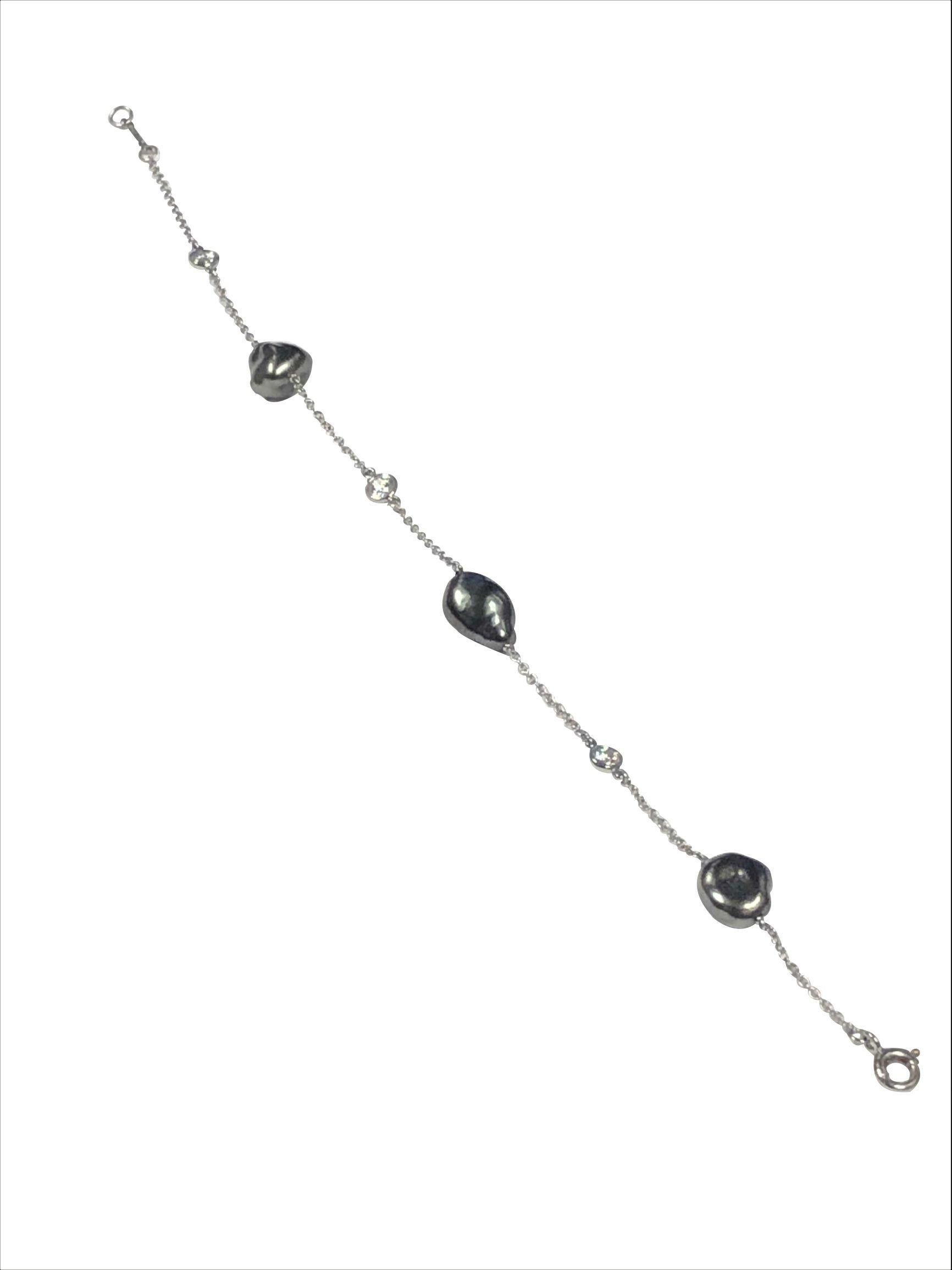 Circa 2010 Elsa Peretti for Tiffany & Company Sprinkle collection, Diamonds by the Yard Platinum, Pearl and Diamond Bracelet. measuring 7 inches in length and set with 3 Tahitian Black Pearls each measuring between 5 to 9 M.M. and further set with