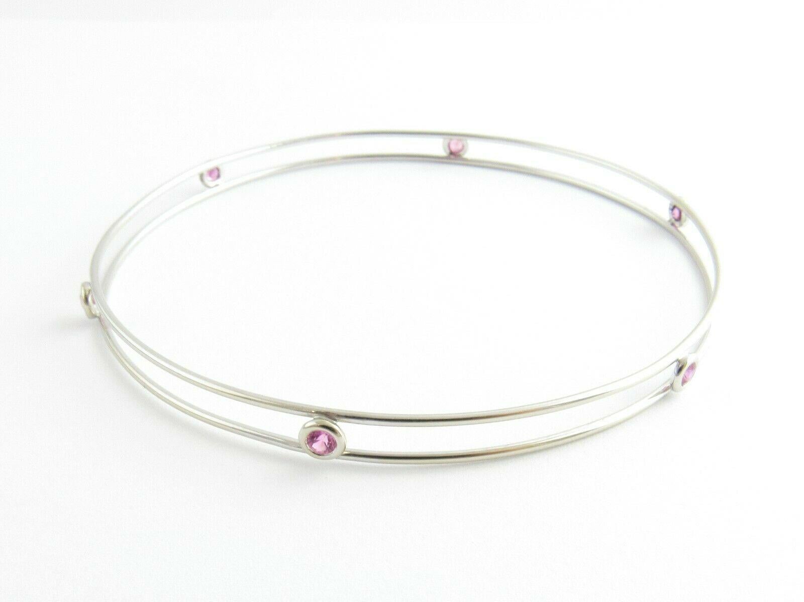 Tiffany & Co. Elsa Peretti Platinum Pink Sapphire By The Yard Bangle Bracelet

This authentic Tiffany & Co. bracelet is from the By the Yard collection.

Six pink sapphires are bezel set between two platinum wire circles.

Bracelet is approx. 8.5