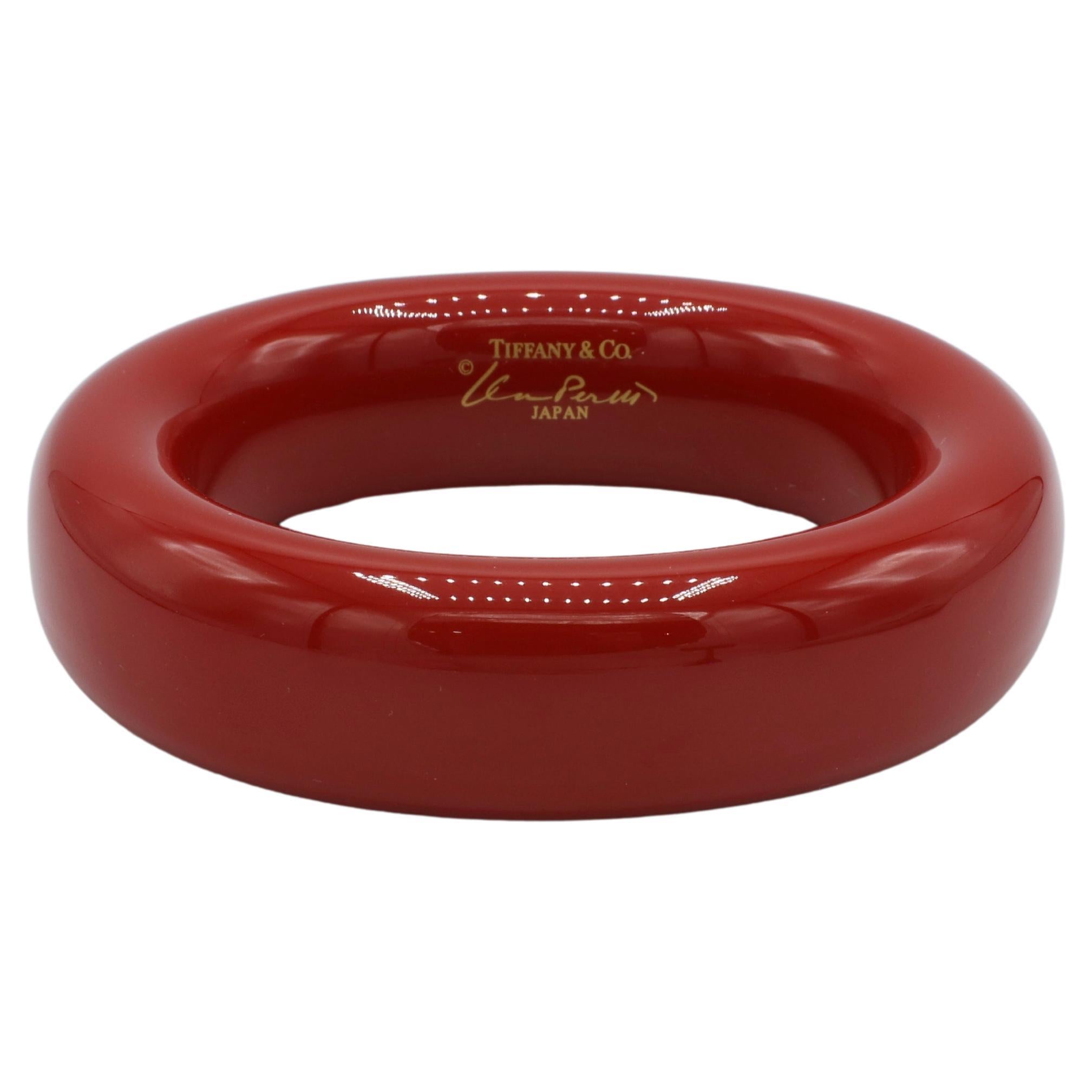Tiffany & Co. Elsa Peretti Red Lacquer Bangle Bracelet
Material: Red lacquer over Japanese hardwood
Weight: 35 grams
Width: 23mm
Inner Circumference: 7.5 inches
Signed: Tiffany & Co. ©Elsa Peretti JAPAN
Retail: $725 USD