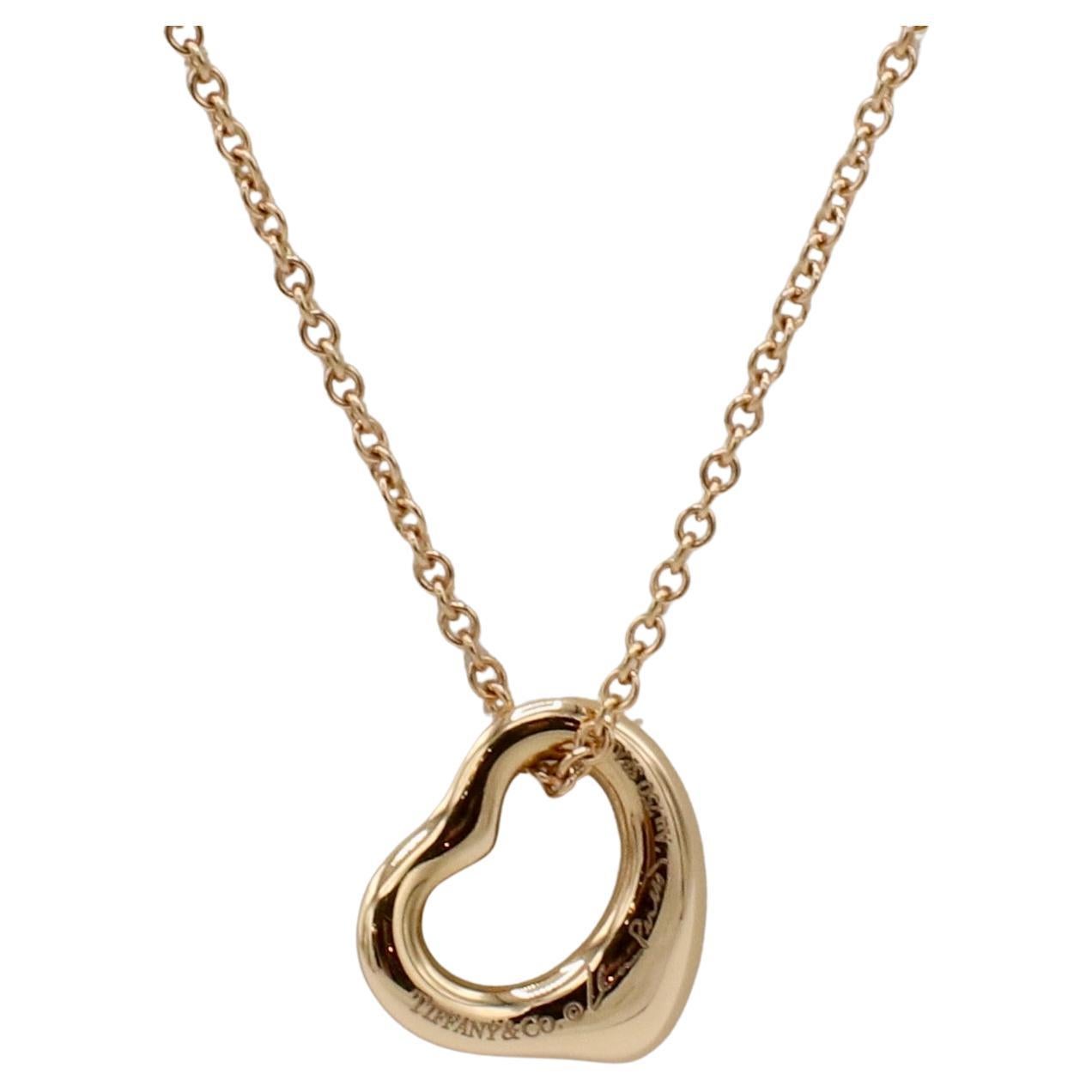Tiffany & Co. Elsa Peretti Rose Gold Open Heart Pendant Necklace 
Metal: 18k rose gold
Weight: 3.1 grams
Heart: 11mm
Chain length: 16 inches
Signed: Tiffany & Co. © Elsa Peretti Au 750 SPAIN
Retail: $1,025 USD