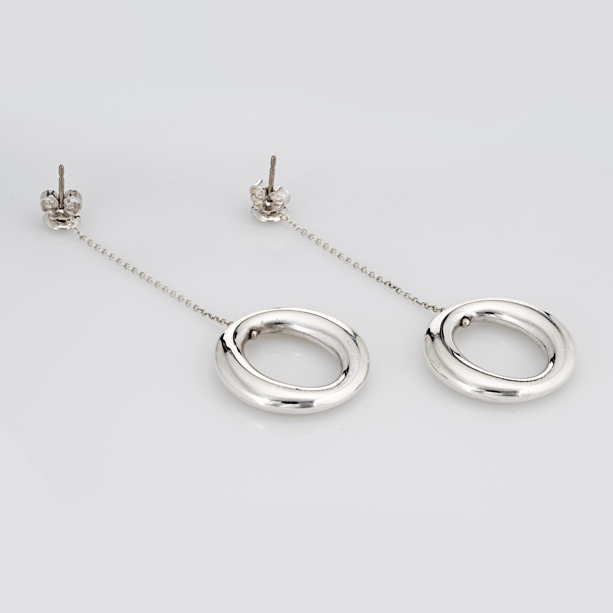 Elegant pair of pre-owned Tiffany & Co 'Sevillana' earrings crafted in sterling silver.

The earrings are designed by Elsa Peretti for Tiffany & Co. The distinct round elliptical design is timeless and great for day or evening wear. The long 2 1/2