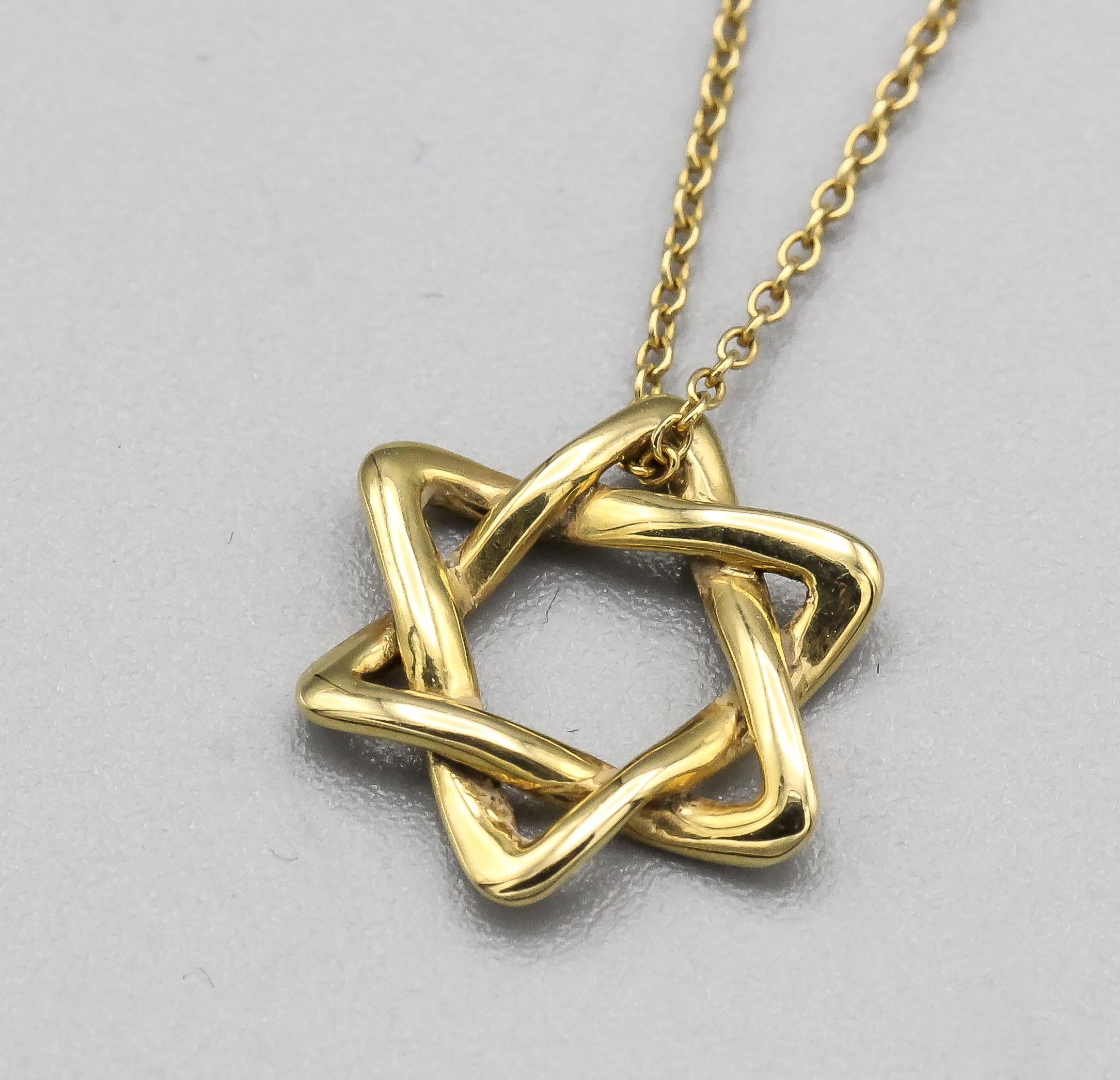 The Tiffany & Co. Elsa Peretti Star of David 18K Yellow Gold Necklace Pendant is a dazzling and meaningful piece of jewelry that beautifully combines iconic design with exquisite craftsmanship. This pendant is part of the celebrated Elsa Peretti