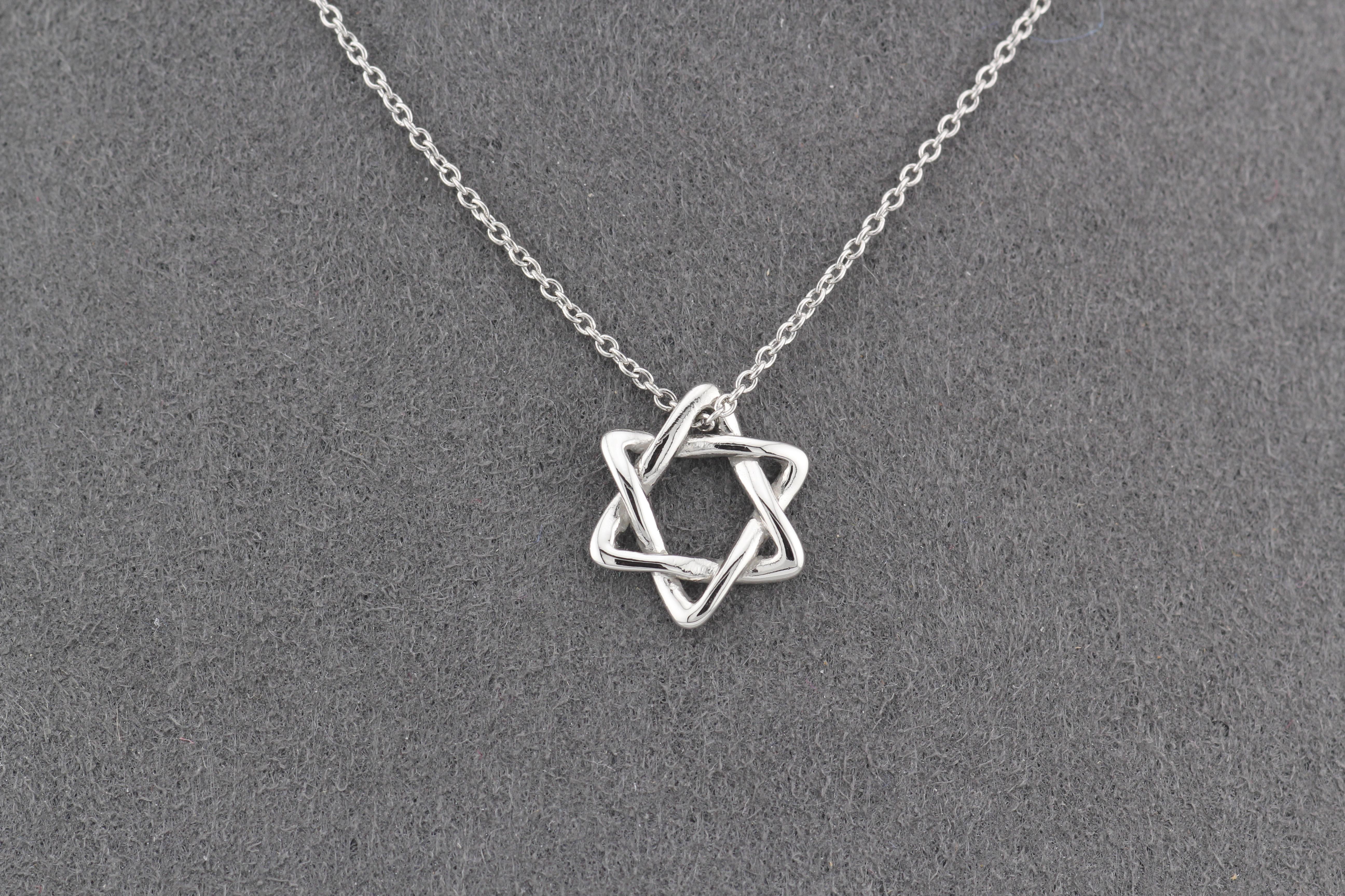 Introducing the Tiffany & Co. Elsa Peretti Star of David Platinum Small Necklace Pendant, a timeless and elegant expression of faith and style. Crafted with the utmost precision and artistry, this exquisite pendant is part of the iconic Elsa Peretti