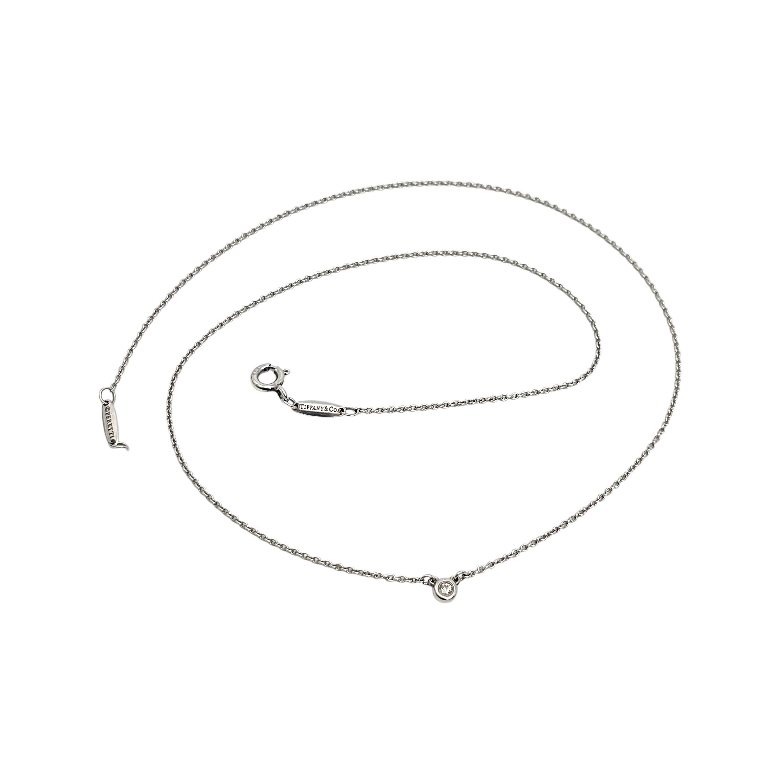 Collana a catena con diamante singolo in argento 925 da .03ct di Elsa Peretti for Tiffany & Co.

Dalla linea iconica Diamonds By The Yard di Tiffany, questa collana lunga 16 3/4