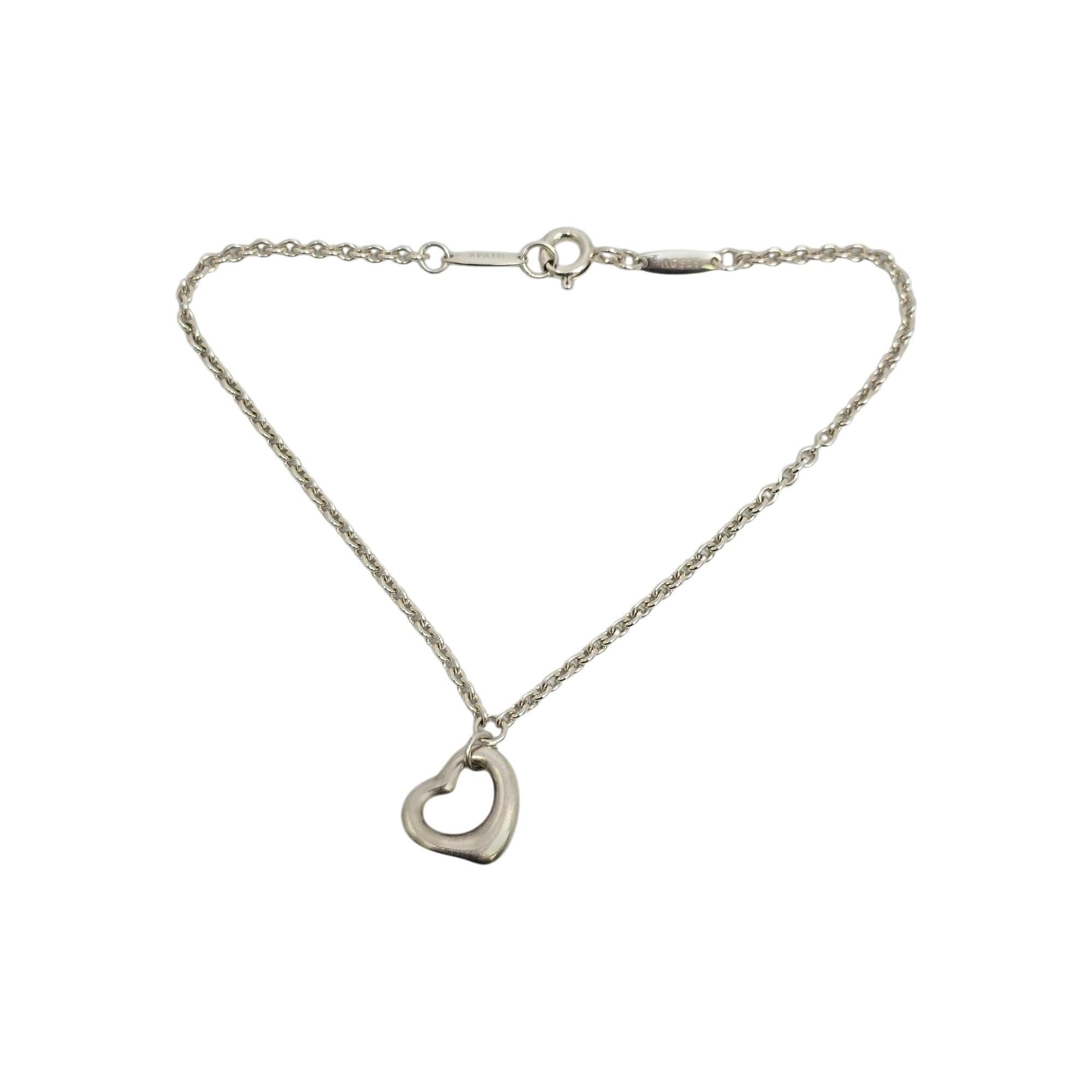 Sterling silver open heart bracelet by Elsa Peretti for Tiffany & Co, with pouch.

Elsa Peretti's iconic open heart design celebrates the spirit of love. This bracelet features an open heart dangle. Tiffany & Co pouch is included. Tiffany & Co box