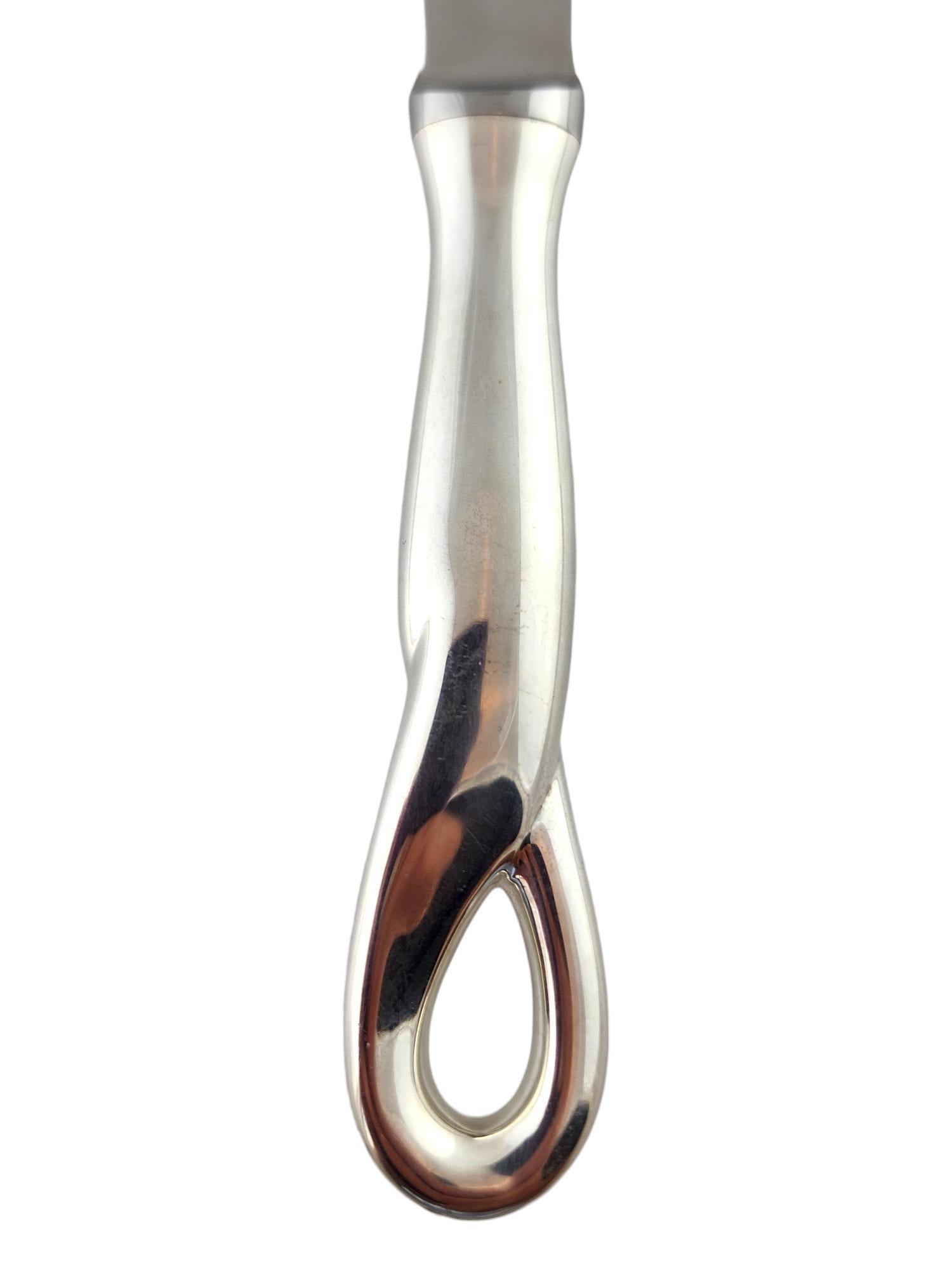 Tiffany & Co Elsa Peretti Sterling Silver Bar/Cheese Knife #18639

This beautiful bar and cheese knife by Elsa Peretti by designer Tiffany & Co was meticulously crafted from sterling silver and would make an amazing addition to your bar or