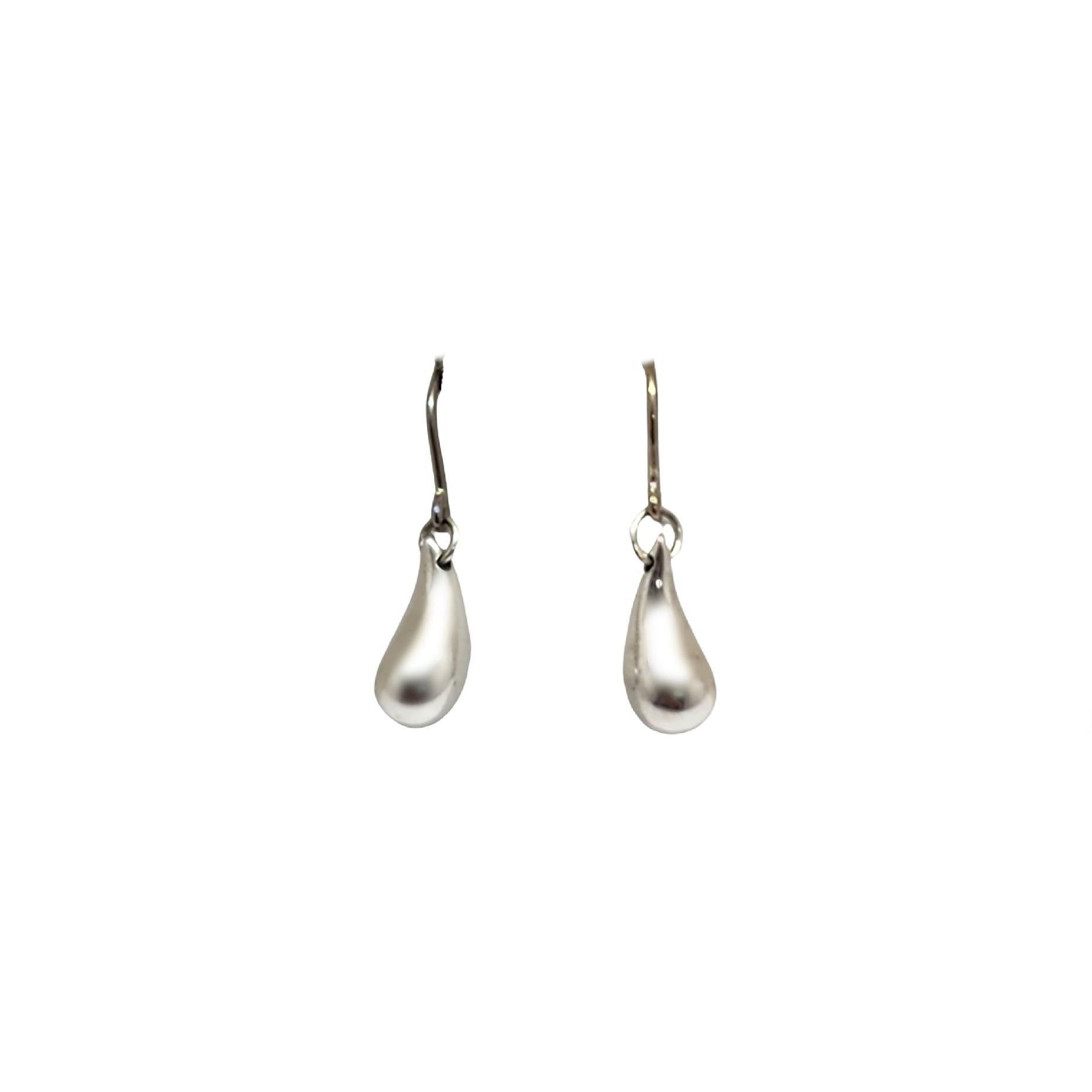Tiffany & Co sterling silver teardrop dangle earrings by Elsa Peretti.

Authentic Tiffany earrings in Elsa Peretti's signature teardrop design, a timeless classic. Tiffany box and pouch are not included.

Measures approx 1