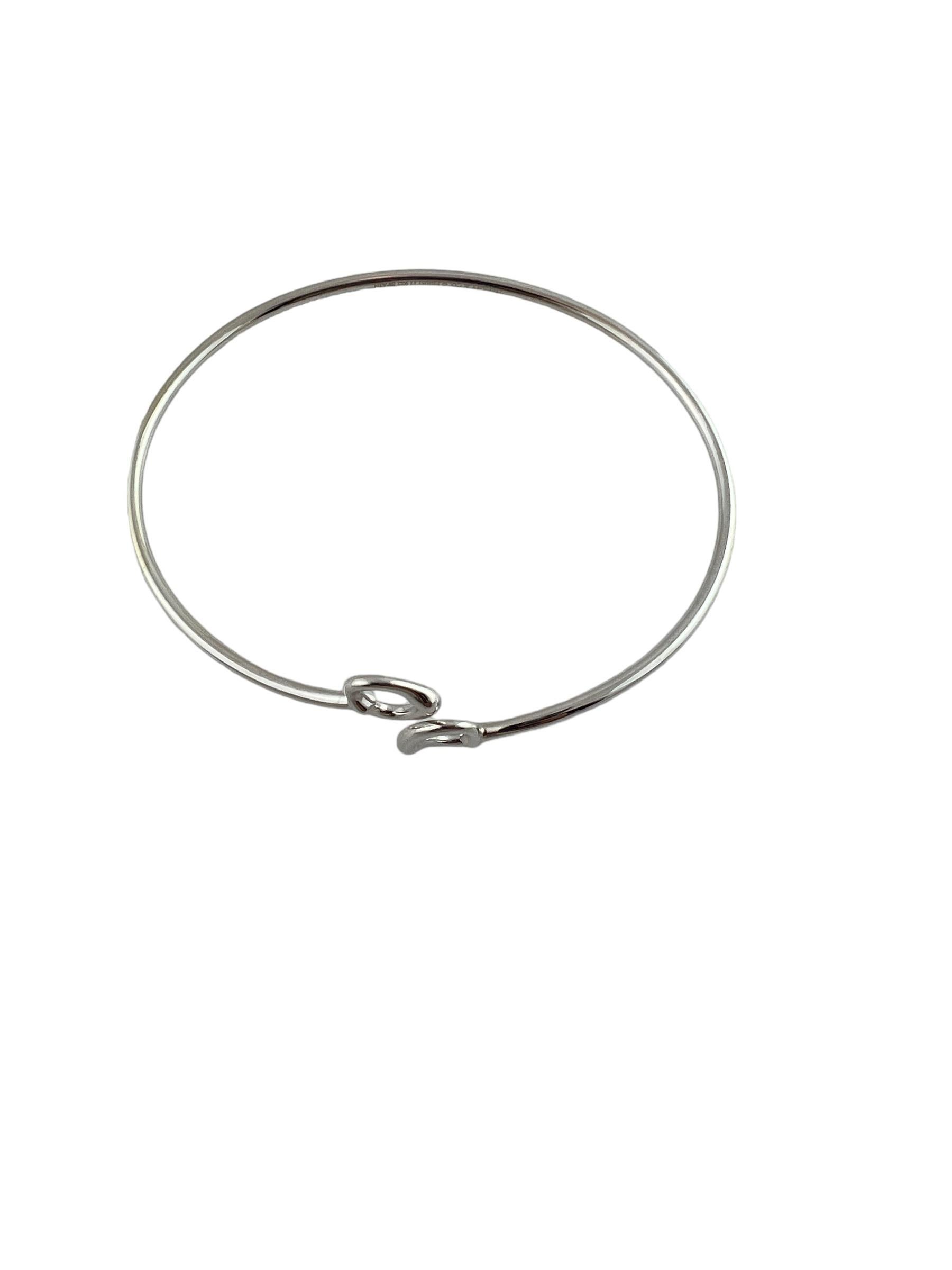 Tiffany & Co. Elsa Peretti Sterling Silver Double Open Heart Bangle Bracelet #15447

This sterling silver double open heart bangle bracelet was designed by Elsa Peretti for Tiffany & Co.

Fits up to 7