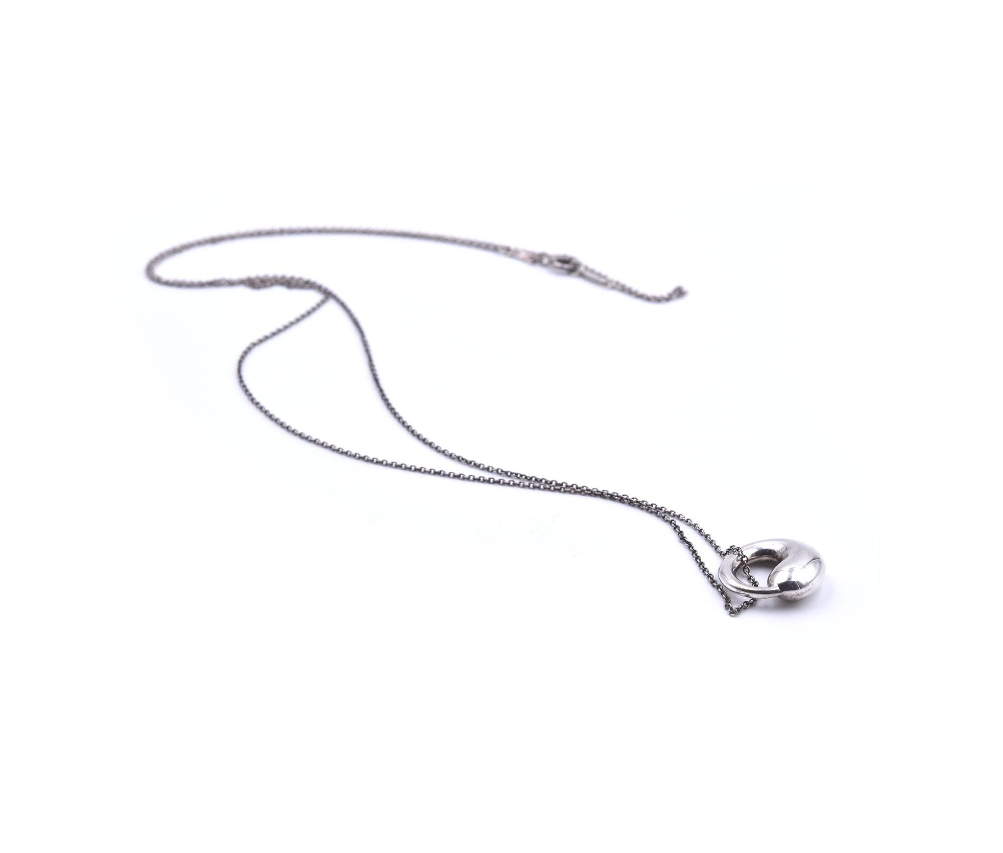 Designer: Tiffany & Co. Elsa Peretti
Material: sterling silver 
Dimensions: necklace is 28-inches long, pendant is 16.55mm by 17.02mm
Weight:  8.07 grams
