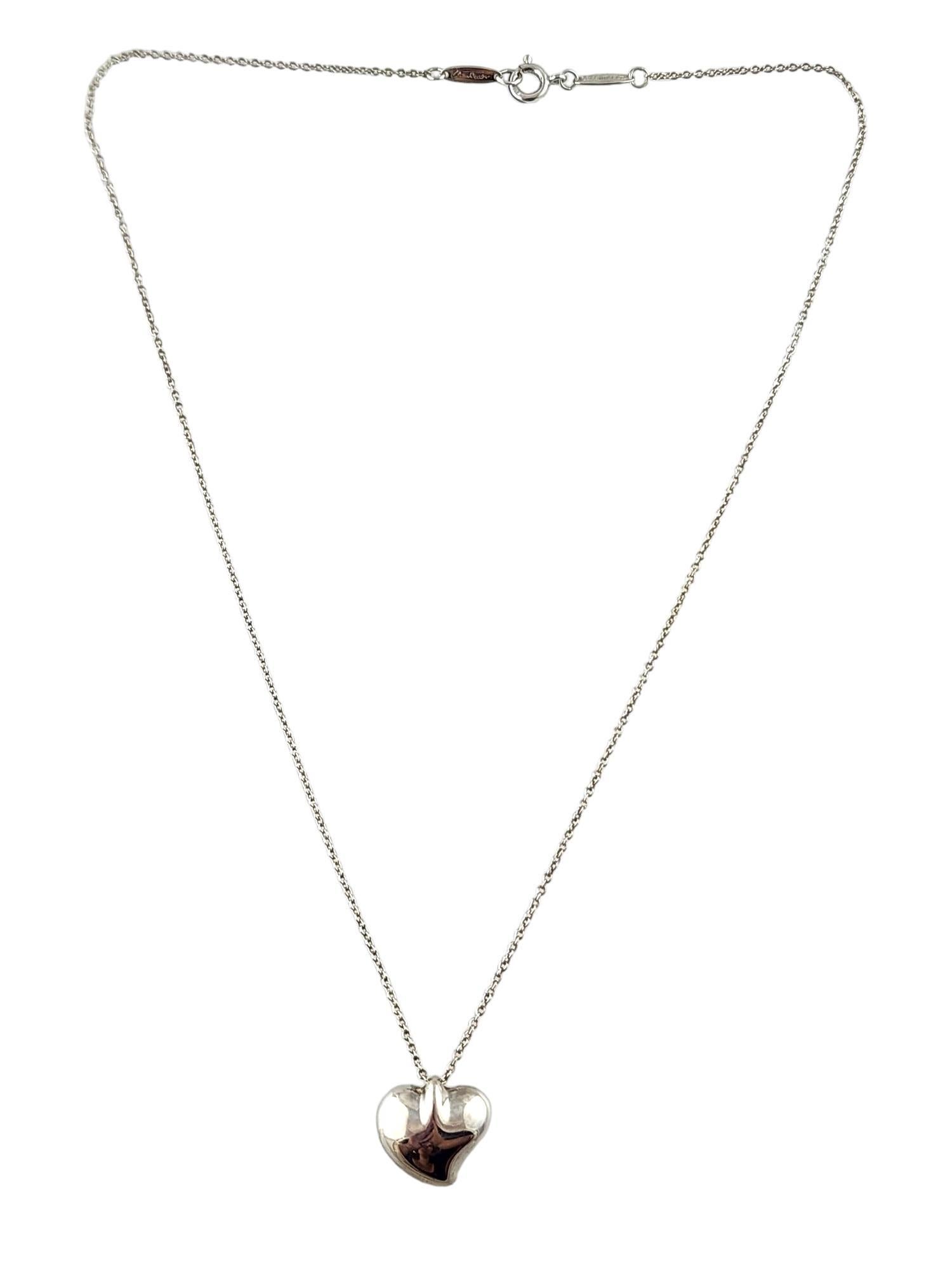 Tiffany & Co Elsa Peretti Sterling Silver Full Heart Pendant Necklace 

This gorgeous piece by designer Elsa Peretti for  Tiffany & Co features a stunning heart pendant on a beautiful matching chain all crafted from sterling silver!

Chain length:
