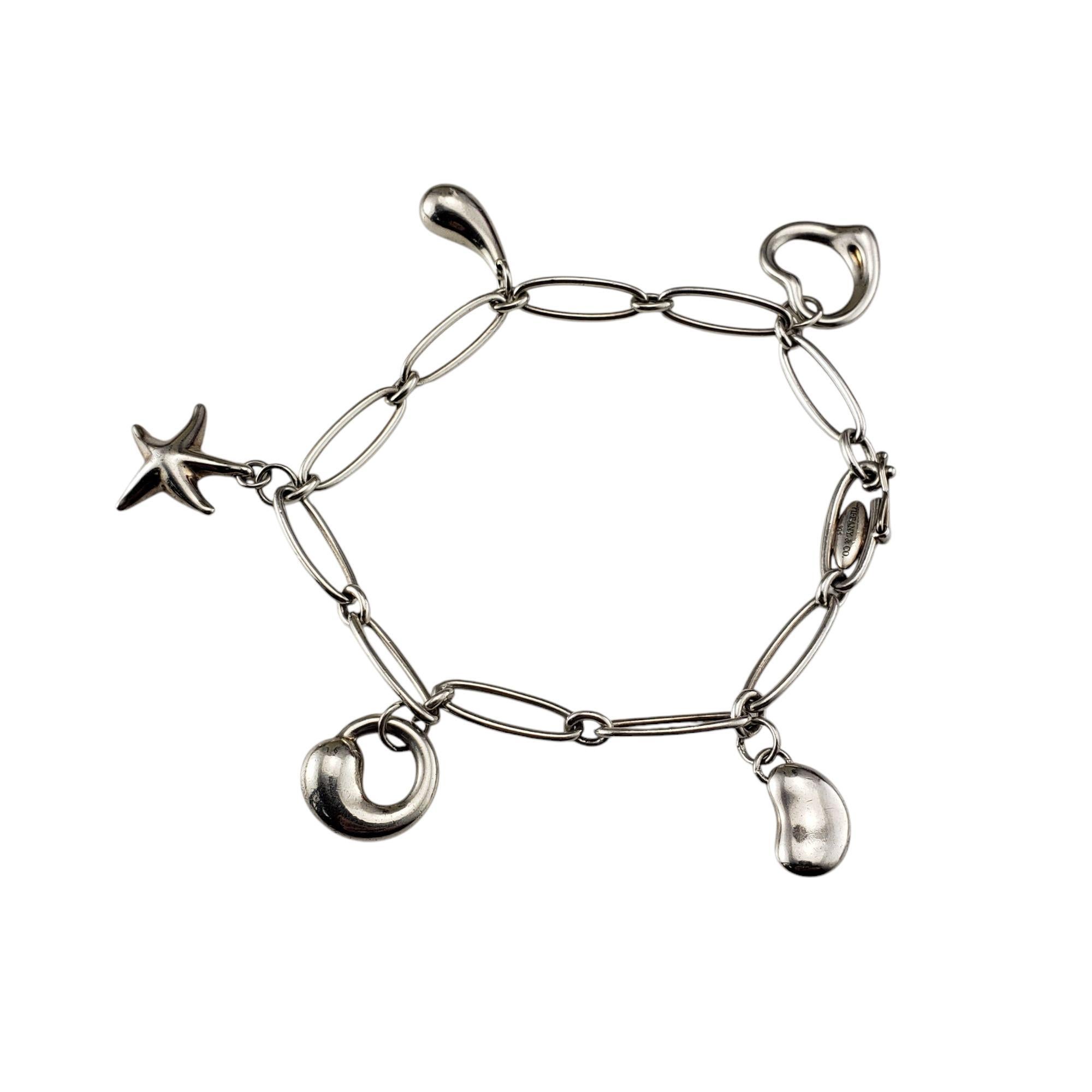 Tiffany & Co. Elsa Peretti Sterling Silver Icon Charm Bracelet-

This stunning sterling silver charm bracelet features five of Elsa Peretti's most iconic designs; the open heart, the bean, the teardrop, the starfish and the eternal circle.

Size: