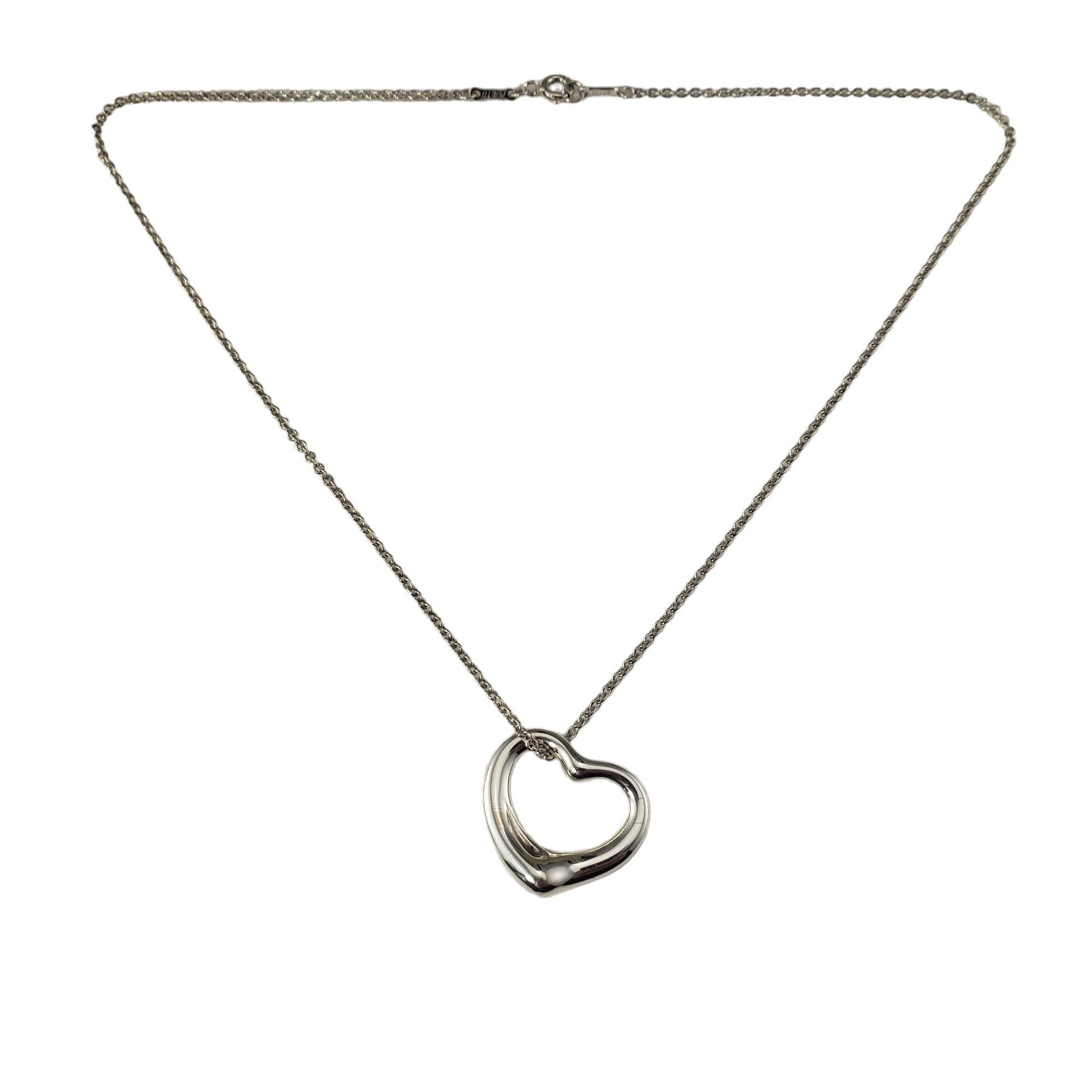 Tiffany & Co. Elsa Peretti Sterling Silver Open Heart Necklace

This elegant open heart pendant necklace is crafted in beautifully detailed sterling silver by Elsa Peretti for Tiffany & Co.

Size: 20 mm x 20 mm (pendant)
         16 inches