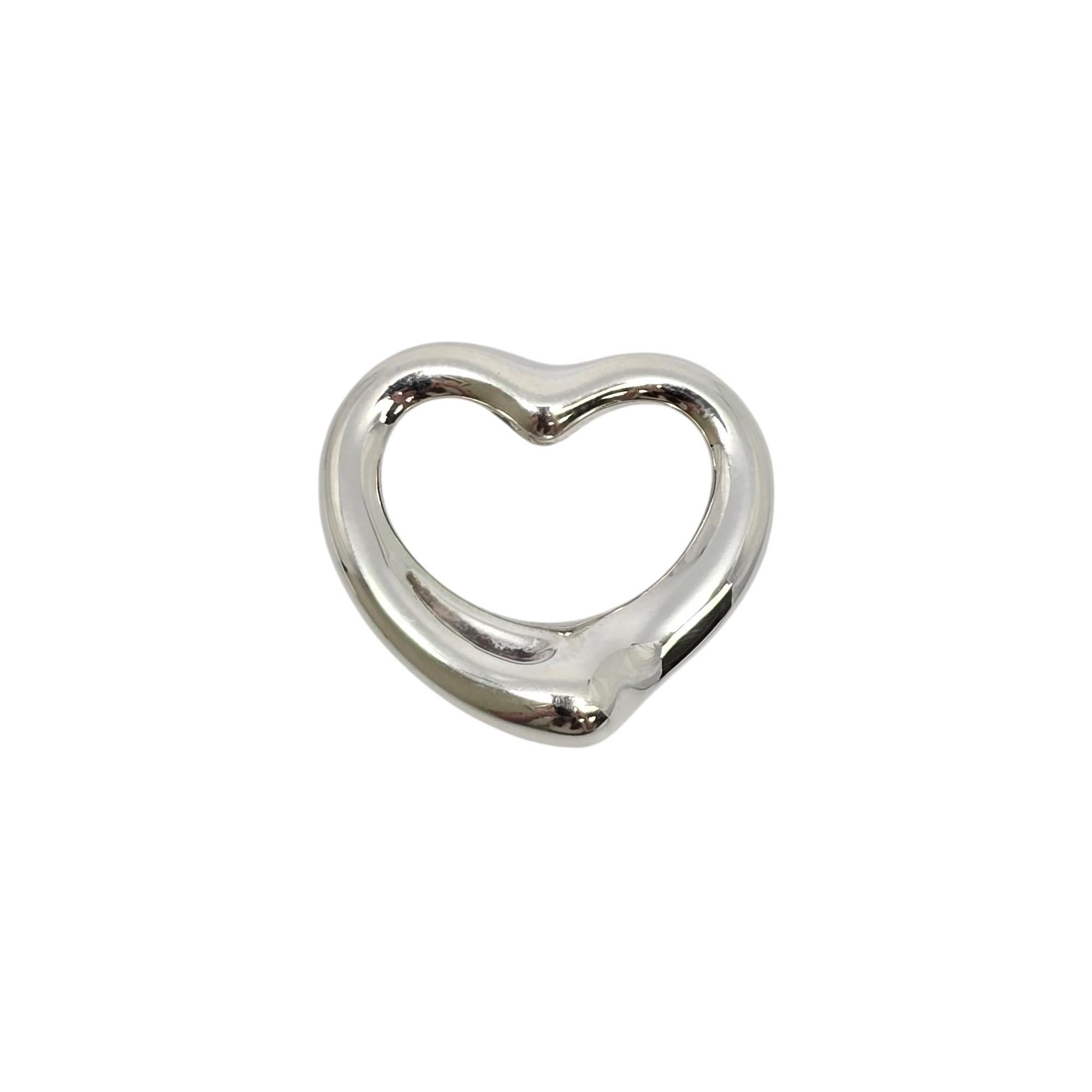 Sterling silver open heart pendant by Elsa Peretti for Tiffany & Co.

Elsa Peretti's iconic open heart design celebrates the spirit of love. Tiffany & Co box and pouch are not included.

Measures approx 13/16