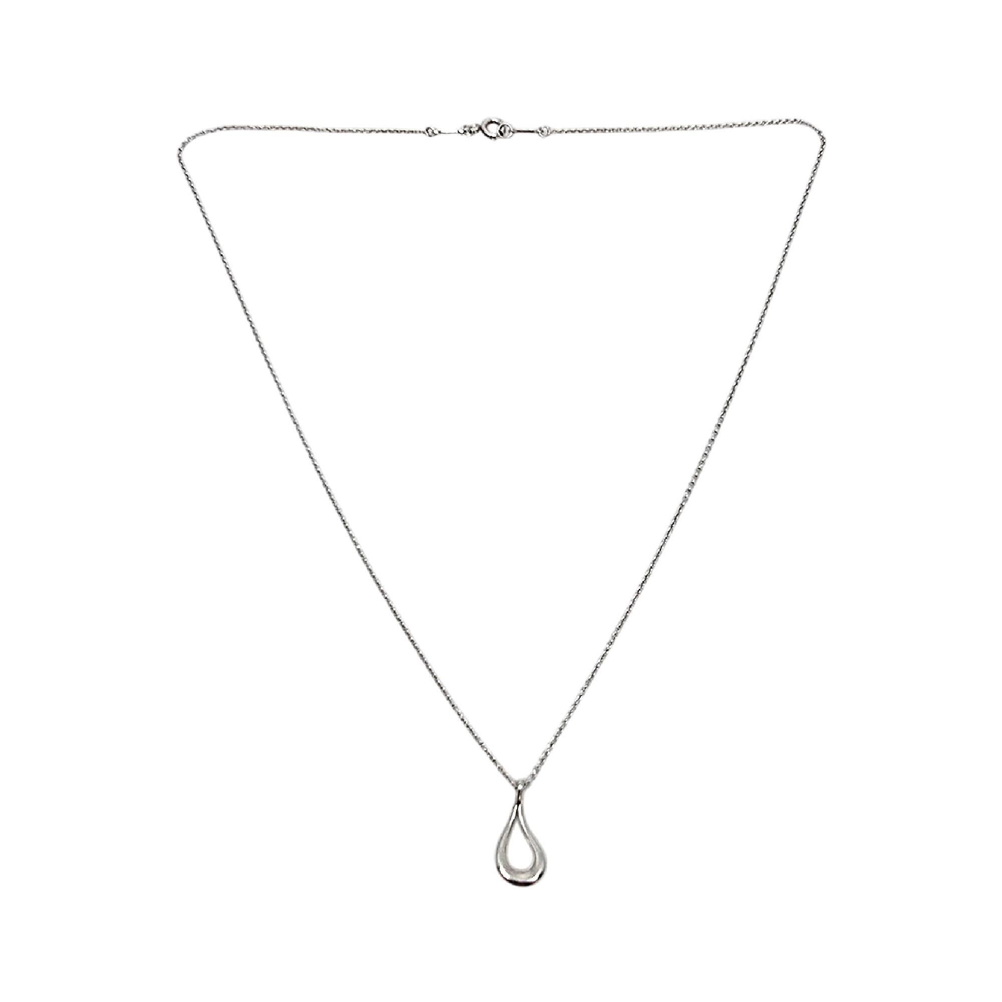 Sterling silver open teardrop necklace by Elsa Peretti for Tiffany & Co.

Authentic Tiffany necklace featuring Elsa Peretti's open teardrop design on a delicate thin Tiffany chain. Tiffany & Co box and pouch are not included.

Chain measures approx