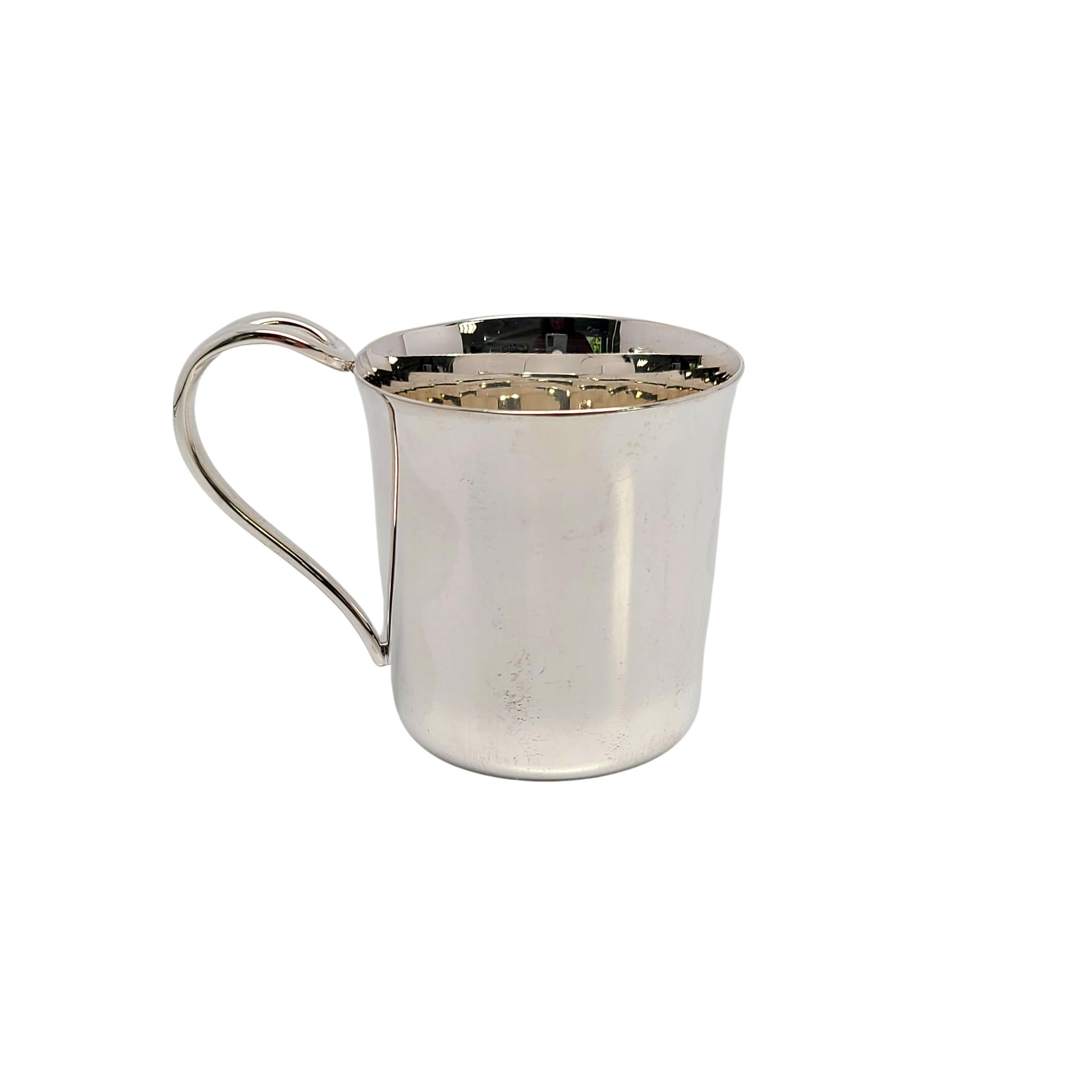 Tiffany & Co sterling silver baby cup in the Padova pattern by Elsa Petertti.

No monogram

A simple and classic child or baby cup with a curved open loop handle and highly polished finish. Does not include Tiffany & Co box or pouch.

Measures