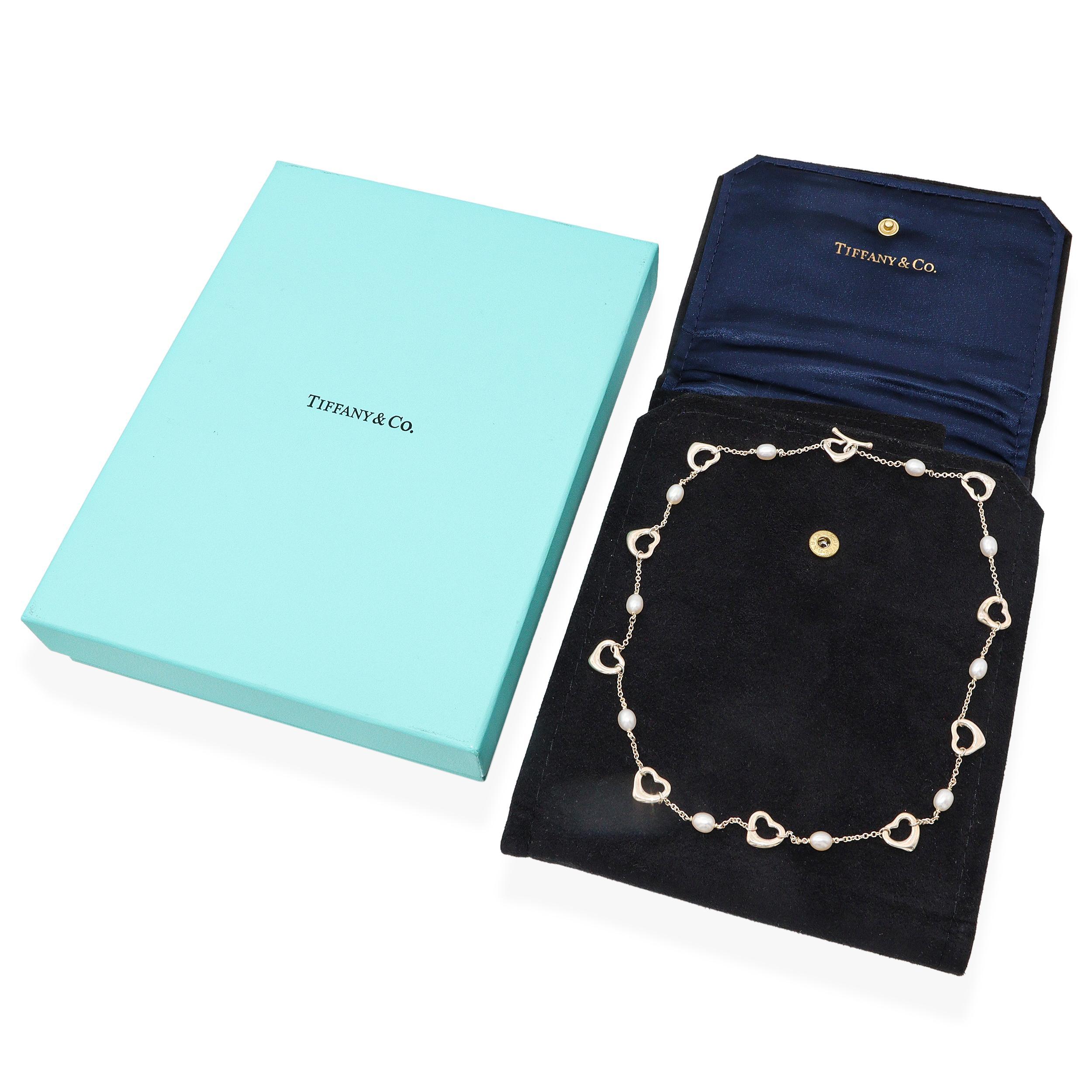 Delicate and timeless, this Tiffany & Co. necklace from the iconic Elsa Peretti collection captures the elegance of simplicity. Crafted in sterling silver, the design features her signature open heart stations—fluid and organic in form—interspersed