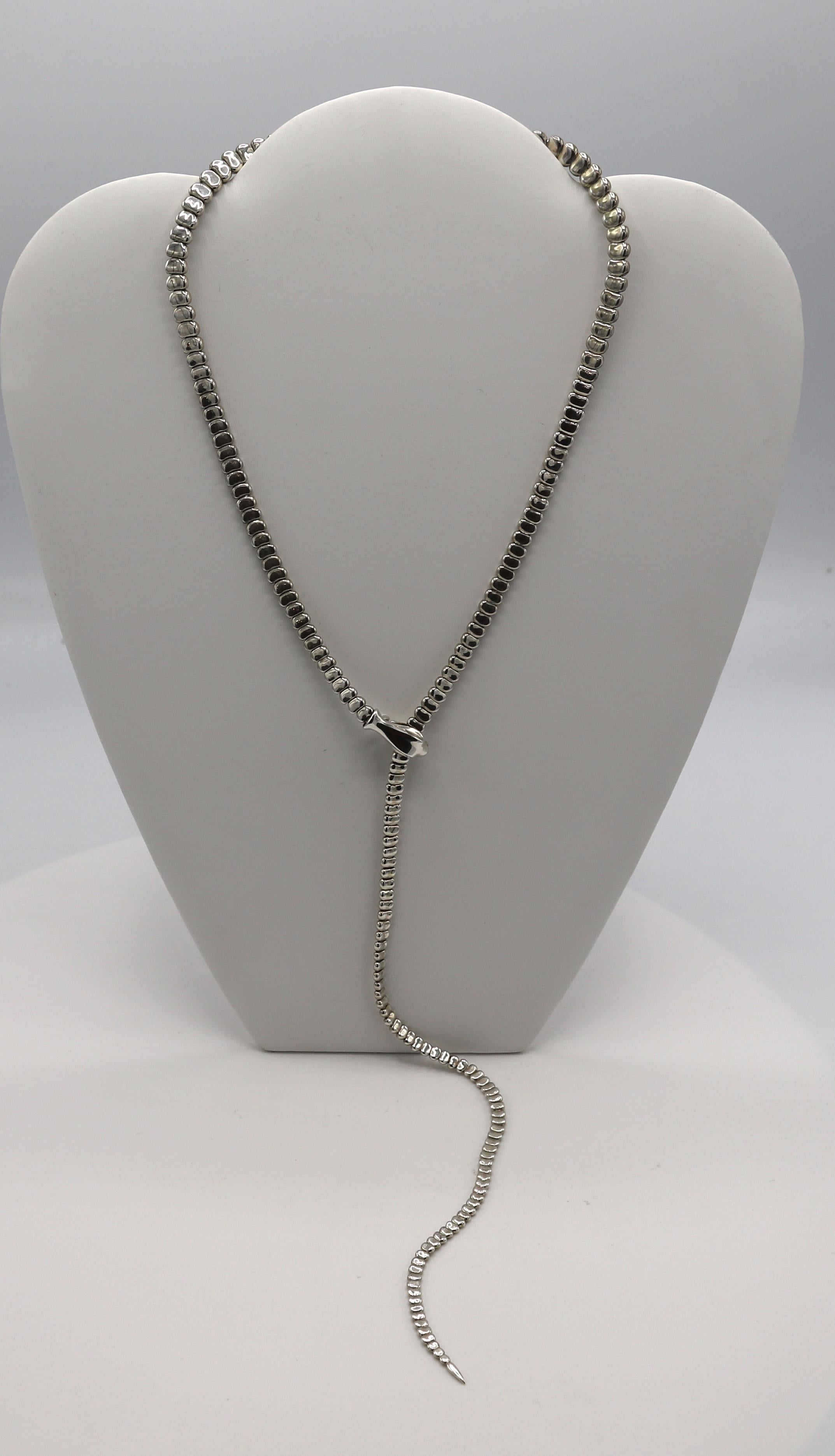 Tiffany & Co. Elsa Peretti Sterling Silver Snake Lariat Necklace 
Metal: Sterling silver
Weight: 64.6 grams
Length: 27.5 inches
Width: 2mm - 8mm
Signed: Tiffany & Co. PERETTI Ag925