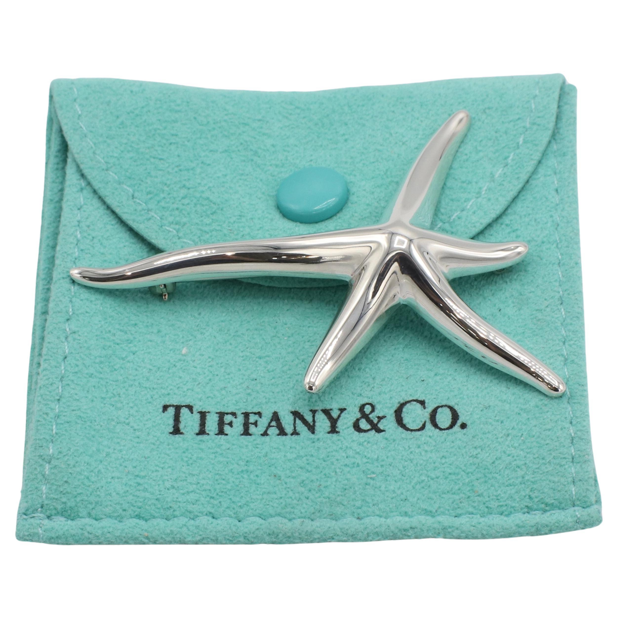 Tiffany & Co. Elsa Peretti Sterling Silver Starfish Star Pin Brooch 
Metal: Sterling silver 925
Weight: 9.17 grams
Dimensions: 54 x 38mm
Signed: Tiffany & Co. © Elsa Peretti SPAIN 925
Retail: $875 USD