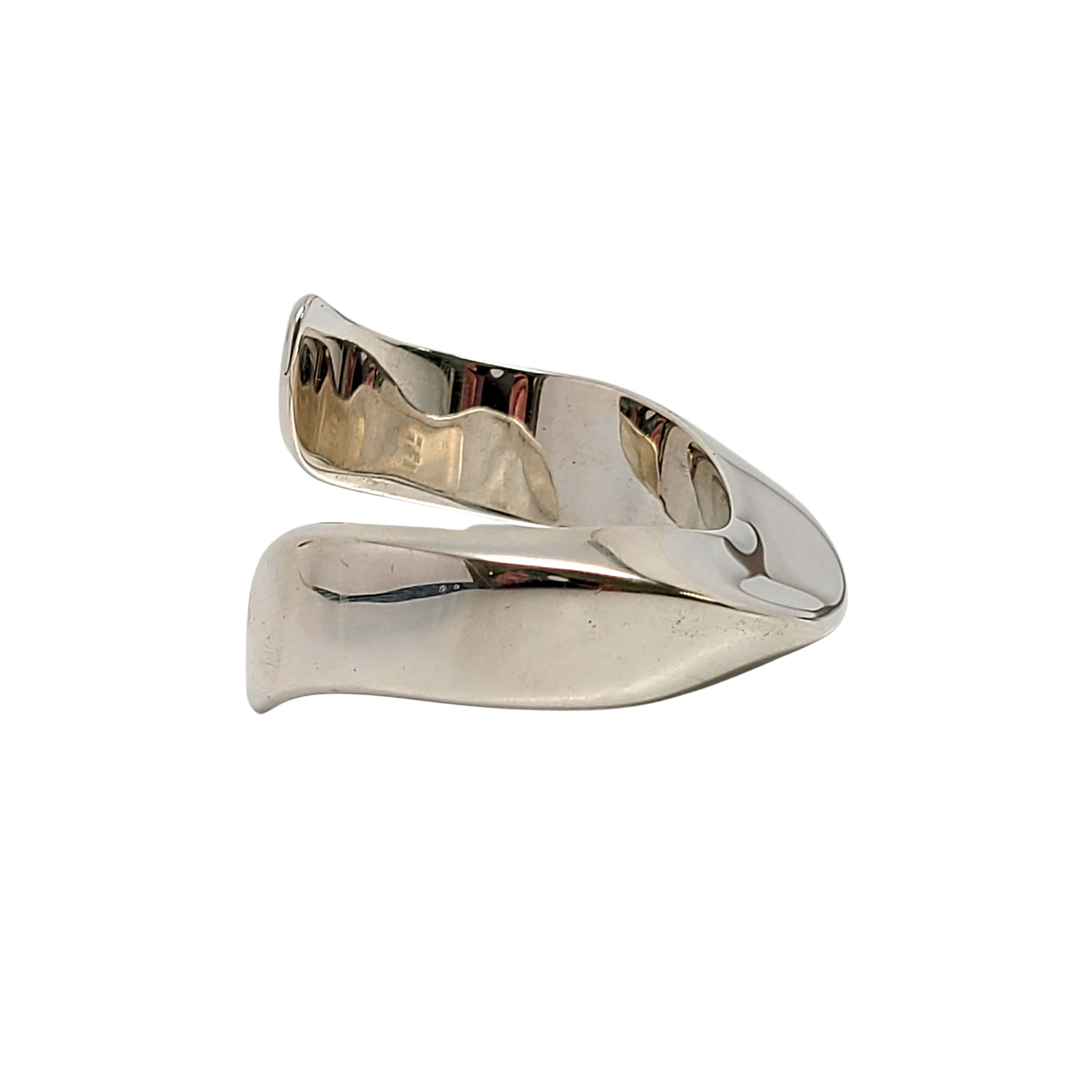 Tiffany & Co sterling silver swirl cuff bracelet by Elsa Peretti.

Authentic Tiffany sterling silver bracelet featuring a contour design, a substantial modern vintage piece. Tiffany pouch and box not included.

Measures approx 6