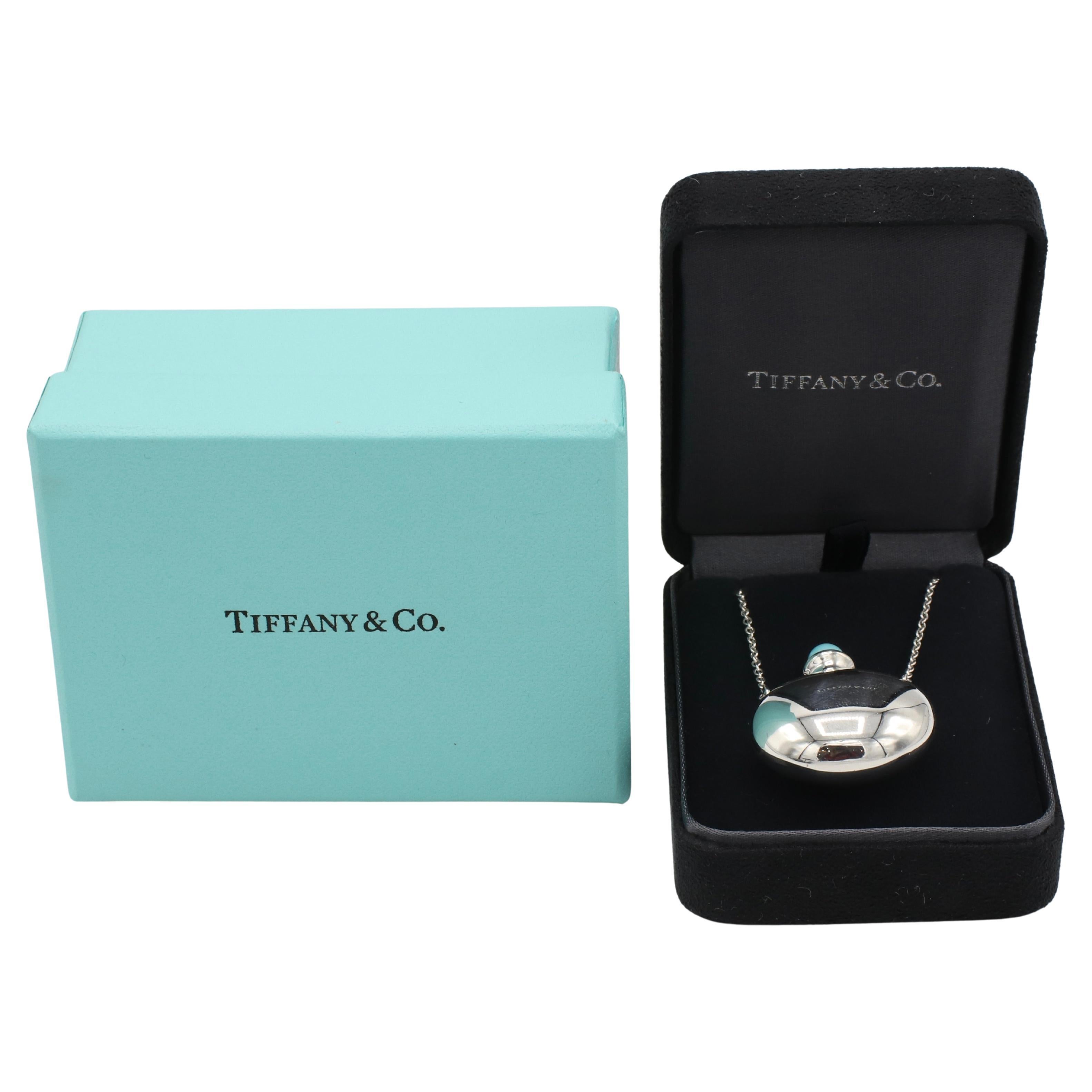 Tiffany & Co. Elsa Peretti Sterling Silver Turquoise Jug Bottle Long Pendant Necklace 
Metal: Sterling silver 
Weight: 14.6 grams
Jug: 35 x 28 mm
Signed: Tiffany & Co. ©Elsa Peretti 925 SPAIN
Length: 28 inches
Retail: $1,200 USD
