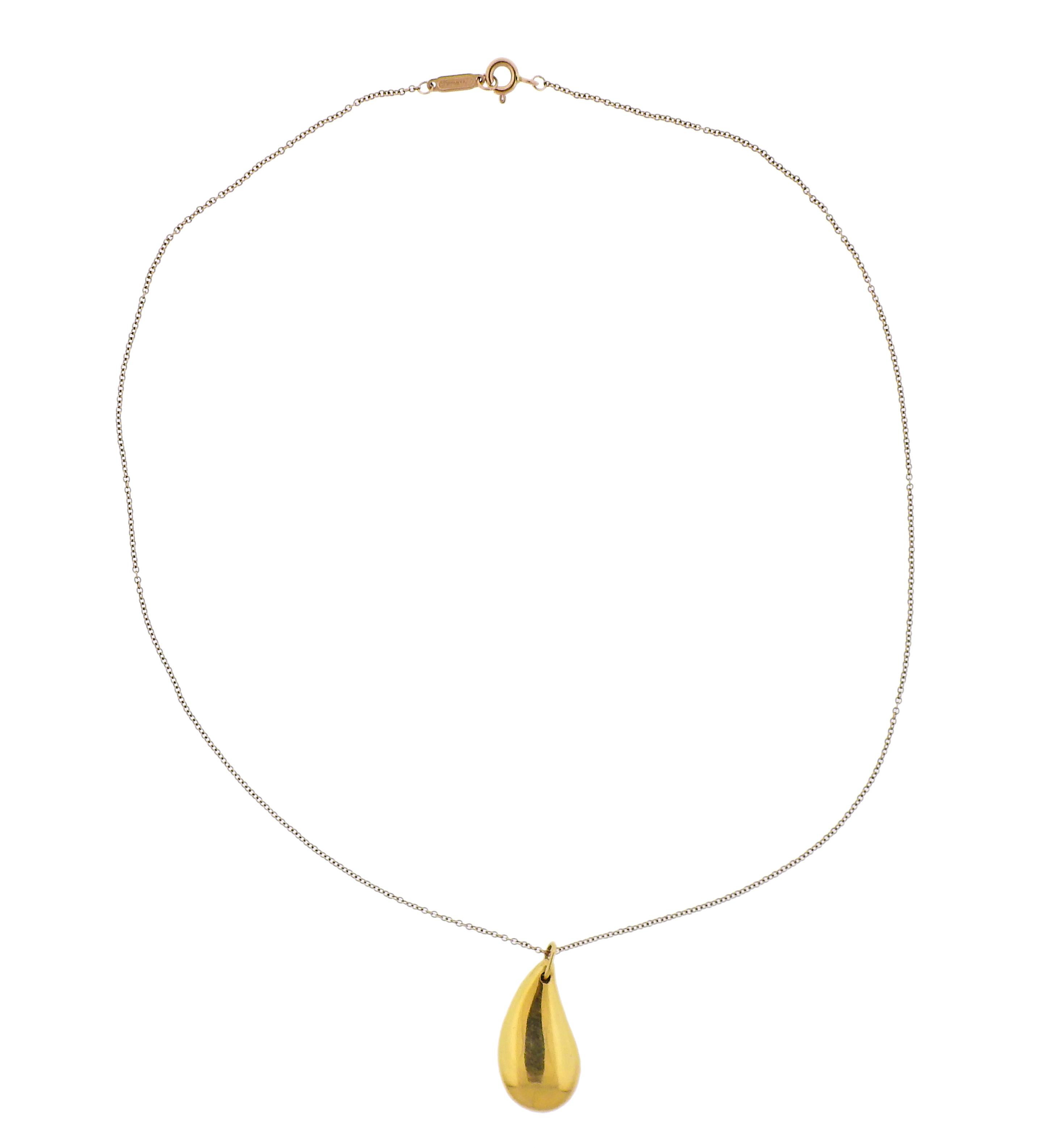 18k yellow gold teardrop pendant necklace, crafted by Elsa Peretti for Tiffany & Co. Necklace is 16