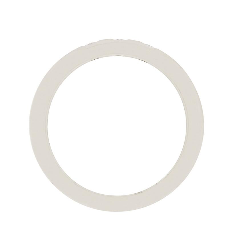 This elegant wedding band is from the Elsa Peretti collection by Tiffany & Co. It is authentic and has original hallmarks from the designer. The band is made from platinum and features three rub over set diamonds which total a weight 0.06 carat, and