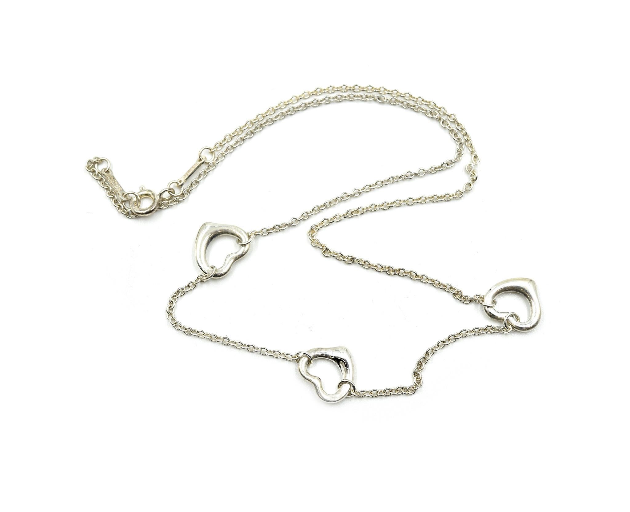 Designer: Tiffany & Co
Collection: Elsa Peretti
Material: sterling silver
Dimensions: necklace measures 16 inches long, each heart pendant measures 1/2 inches long and 1/2 inch wide 
Weight: 4.20 grams
Retail: $275
