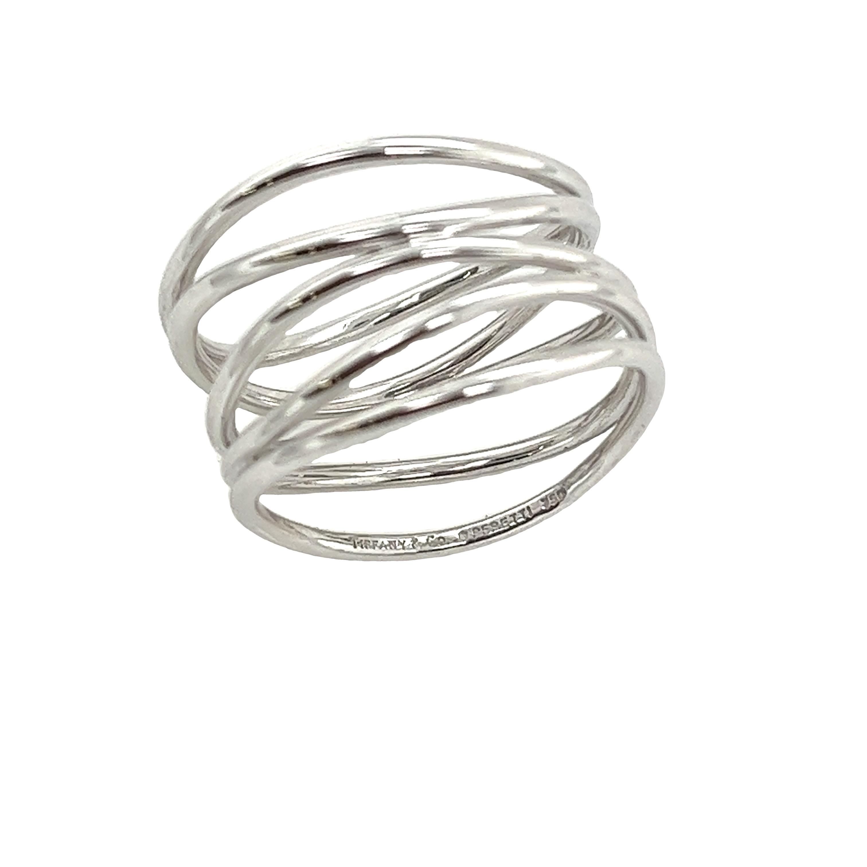 Elevate your style with this stunning Tiffany & Co Elsa Peretti Wave 5 Row Ring in 18ct white gold. The delicate waves of white gold elegantly wrap around your finger, creating a modern and sophisticated look.

•	Width of Band: 9.2mm 
•	Width of