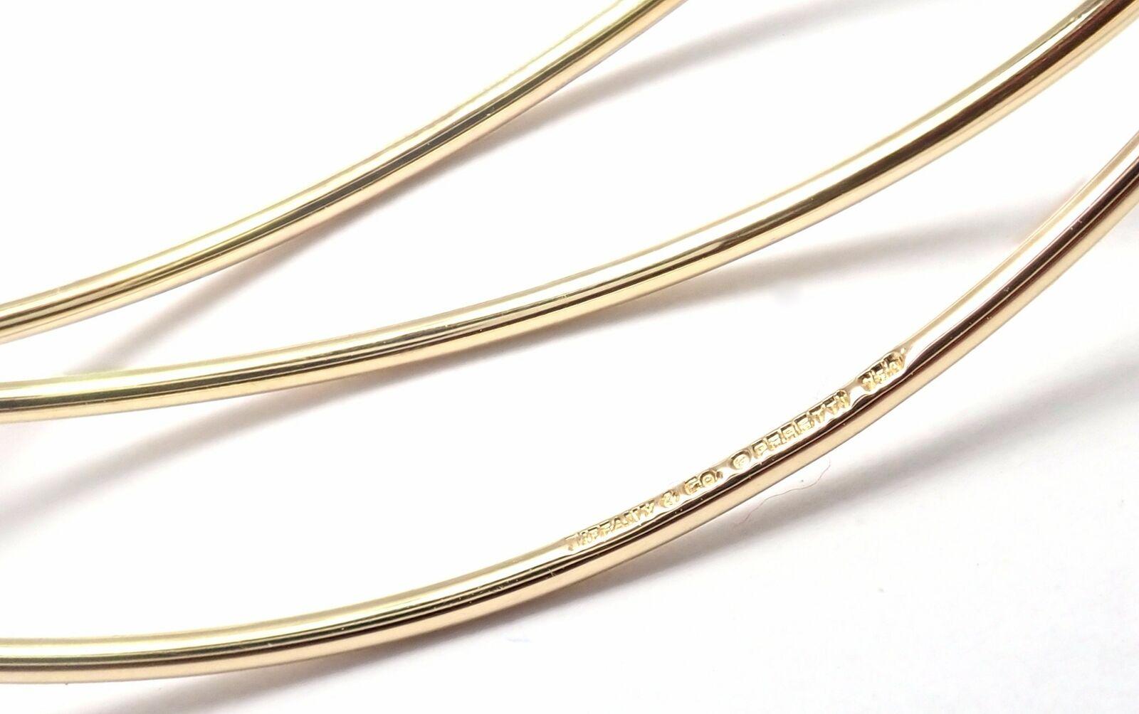 18k Yellow Gold Three Tow Bangle Bracelet by Elsa Peretti for Tiffany & Co. 
Details: 
Size: Medium 6.5