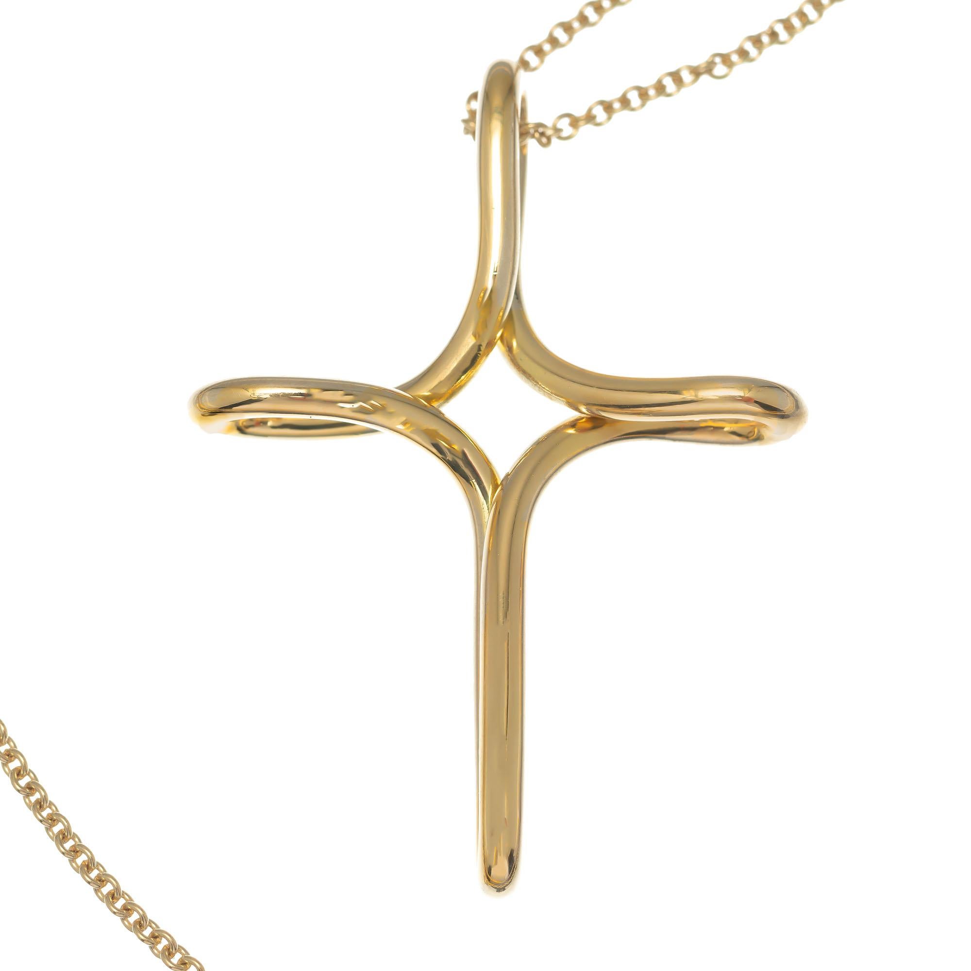 Elsa Peretti Design for Tiffany & Co. 18k yellow gold Infinity cross pendant necklace, considered large size, suspended from a 30 Inch 18k yellow gold link chain. Both pieces clearly marked with Tiffany & Co hallmarks and gold content

18k yellow