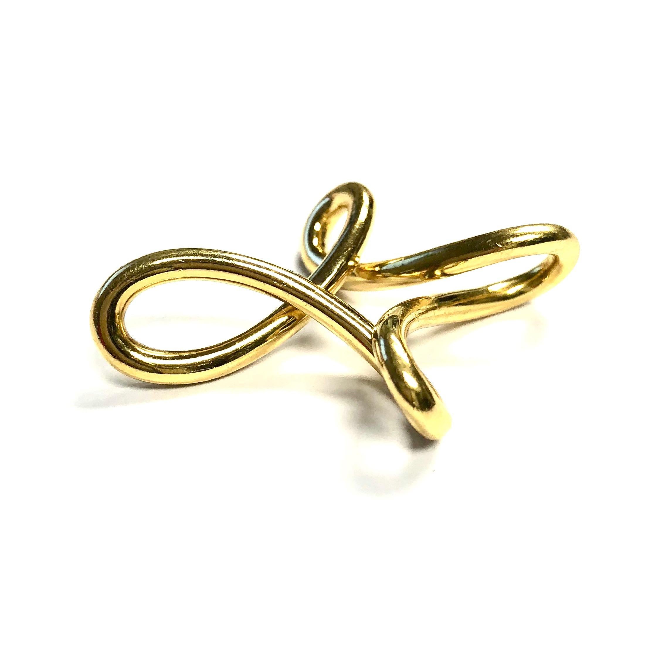 Elsa Peretti for Tiffany & Co 18K yellow gold infinity cross pendant. 
Measurements:  1 3/4