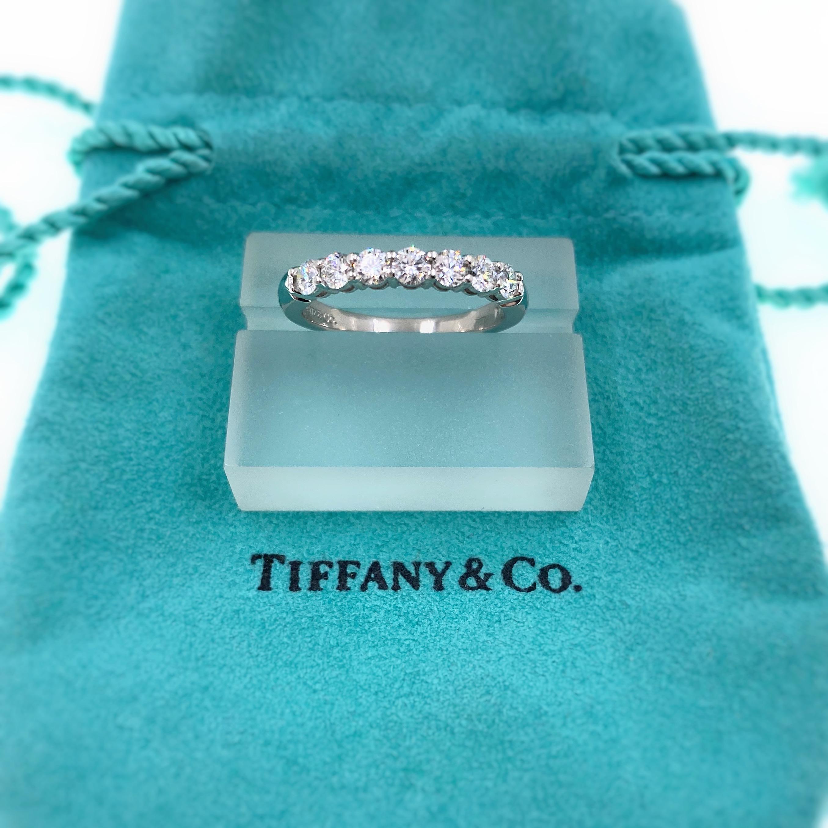 Tiffany & Co
Style: Embrace Shared - Prong Diamond Band Ring
Metal: Platinum PT950
TCW: 0.57 tcw
Size:  6.75 sizable
Main Diamond: 7 Round Brilliant Cut Diamonds
Color & Clarity: F - VVS
Hallmark: ©TIFFANY&CO.PT950
Includes: T&C Jewelry