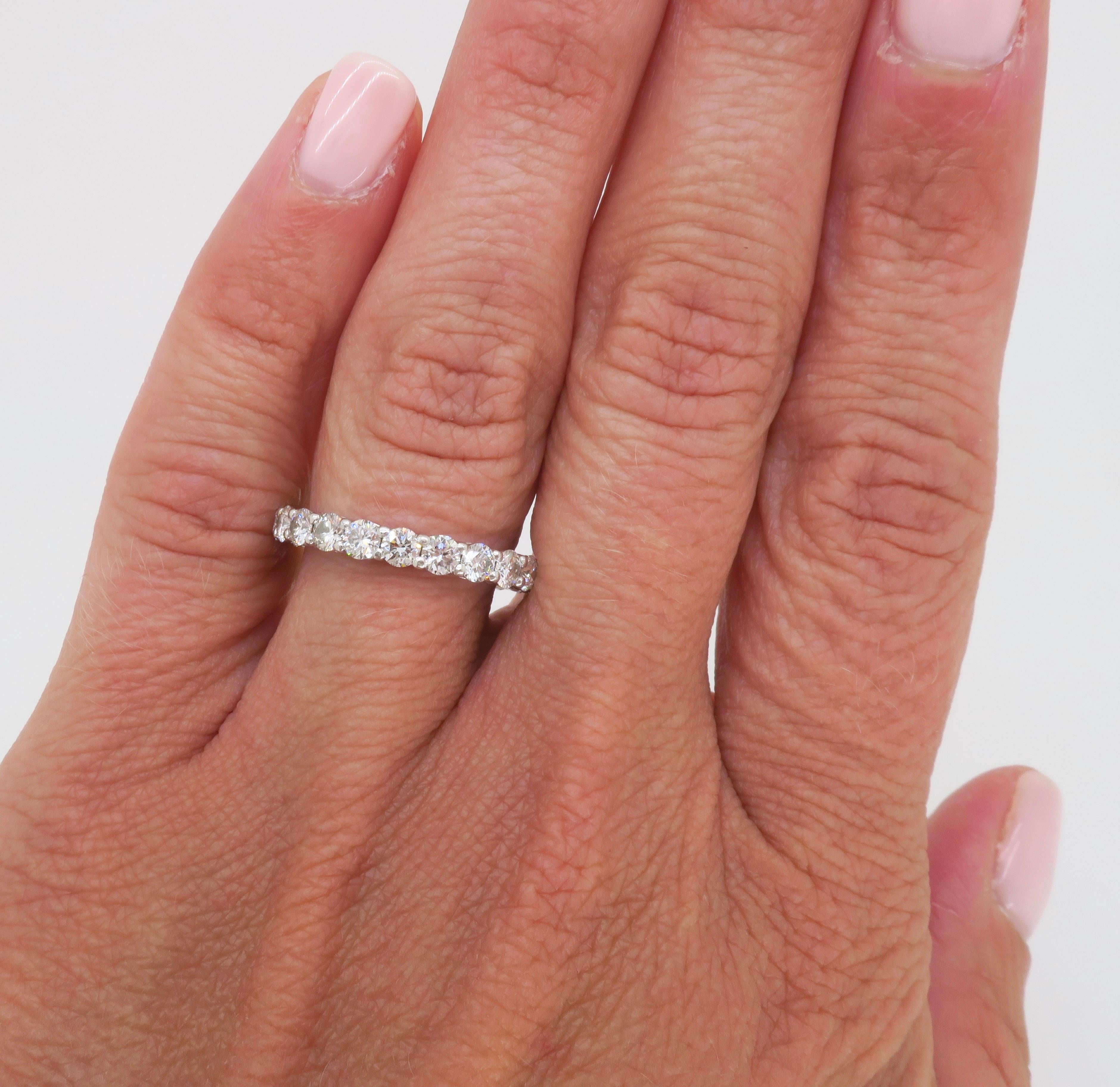 Tiffany & Co. Embrace Diamond Eternity band made in Platinum with 1.80ctw of Round Brilliant Cut Diamonds. 

Diamond Cut: Round Brilliant Cut
Total Diamond Carat Weight: 1.8CTW
Ring Width: 3mm
Average Diamond Color: E-F
Average Diamond Clarity: