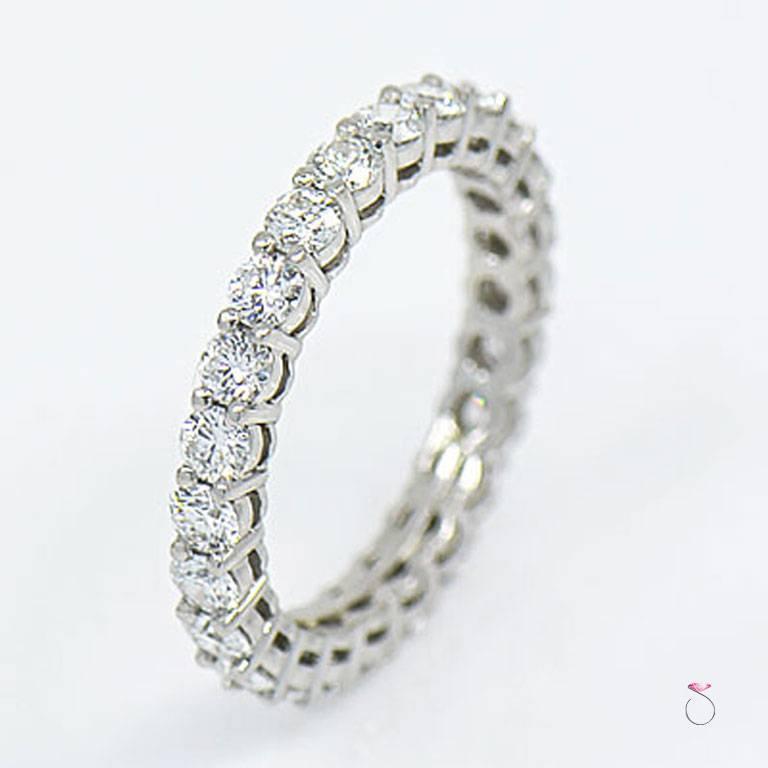 Tiffany & Co. Embrace diamond eternity Band in platinum with round brilliant diamonds all around. This is a 3.00 mm wide eternity band size 7.50. 24 Round brilliant cut diamonds, Totaling approximately 1.96 ct. individually set in shared four