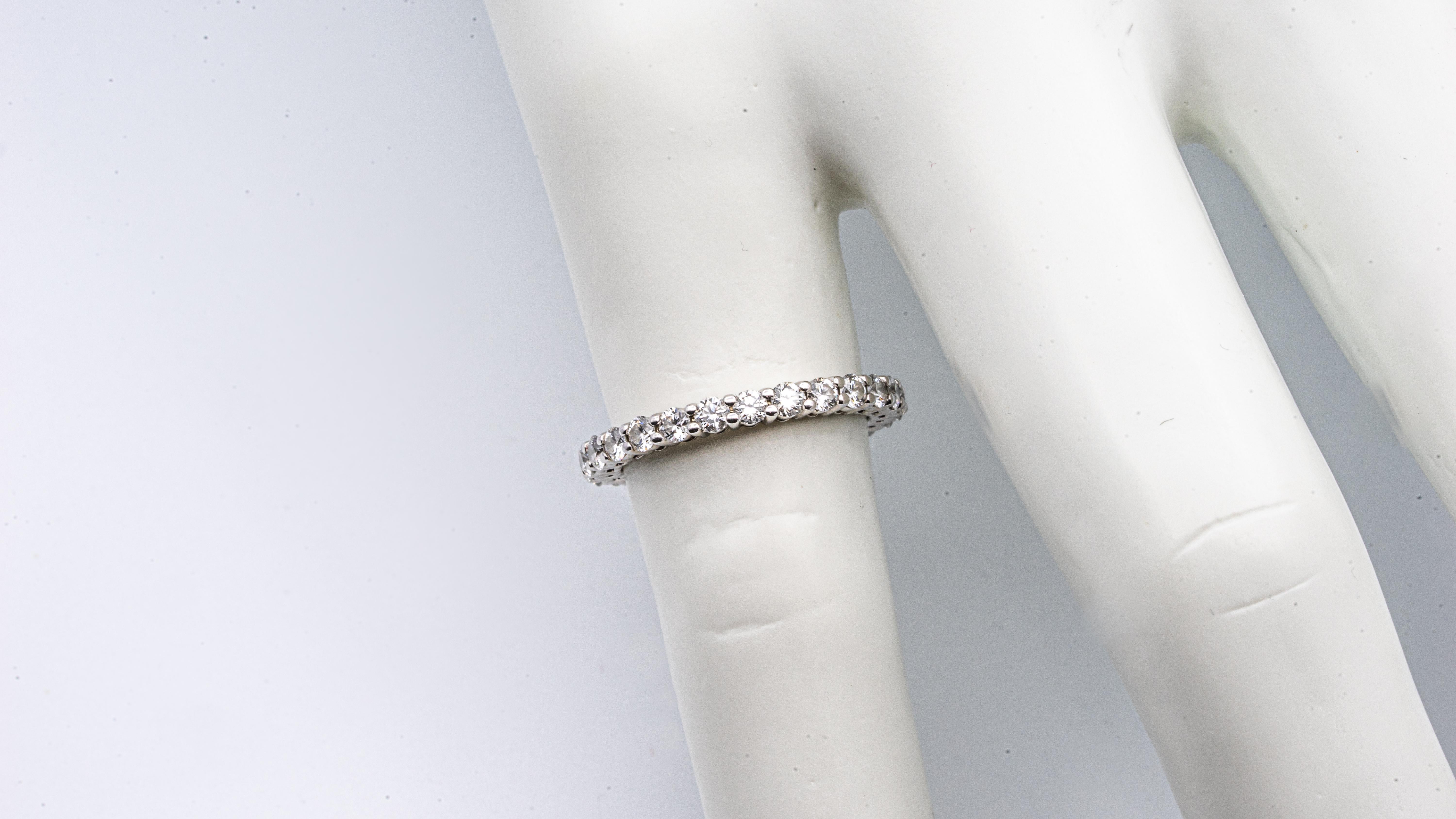 Tiffany Embrace Eternity Band Ring finely crafted in Platinum with round cut brilliant diamonds ranging E-F color VS clarity 
Designer: Tiffany & Co.
Metal: Platinum
Purity: 950
Ring Size: 4
Width: 2.2 mm
Total number of Diamonds : 25
Total Carat