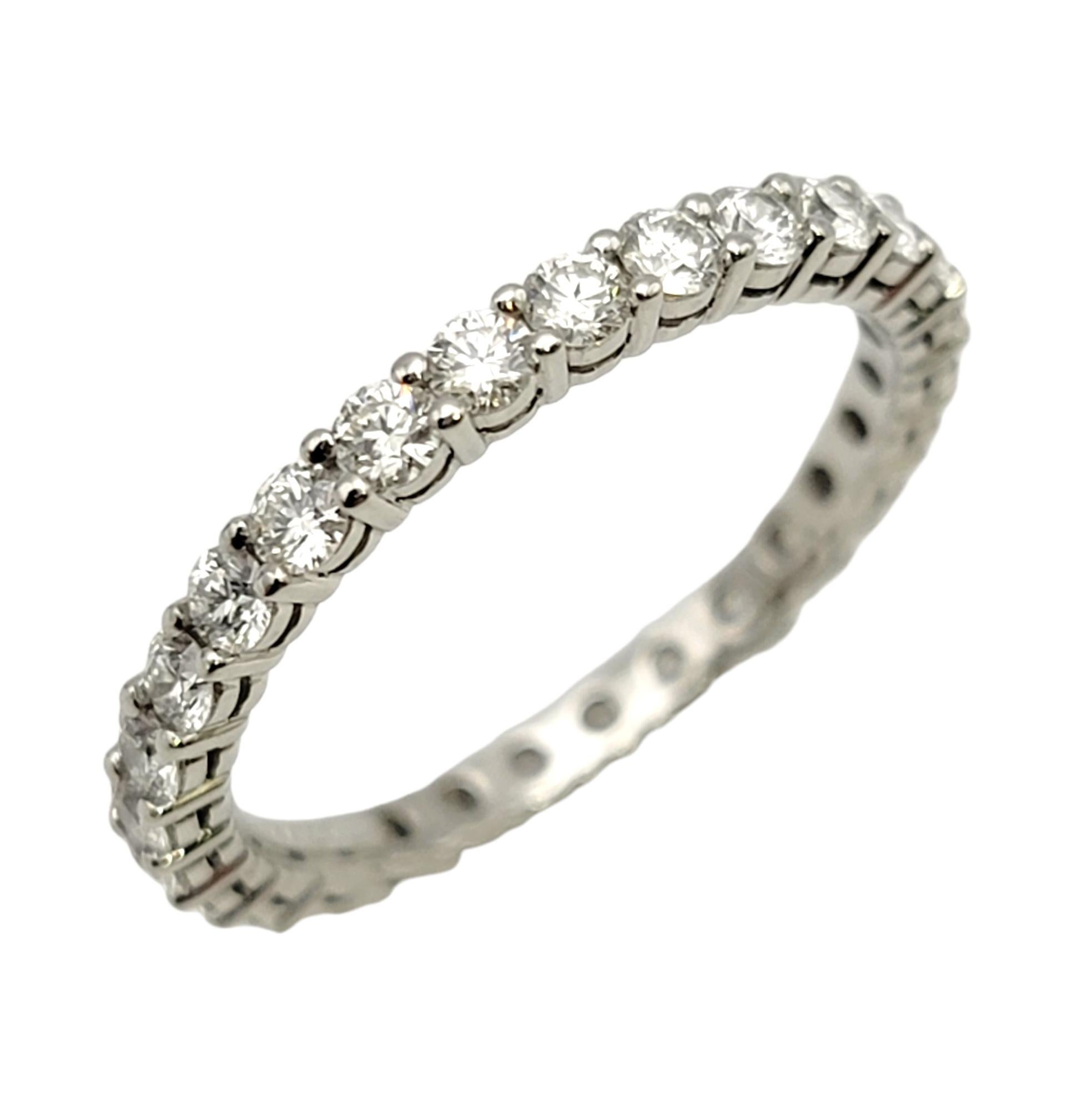 Ring size: 5.75

Stunning Tiffany & Co. diamond 'Embrace' full eternity band ring. This timeless beauty features 28 icy white round diamonds prong set along the entire piece in single elegant row. It would be perfect paired with an engagement ring,