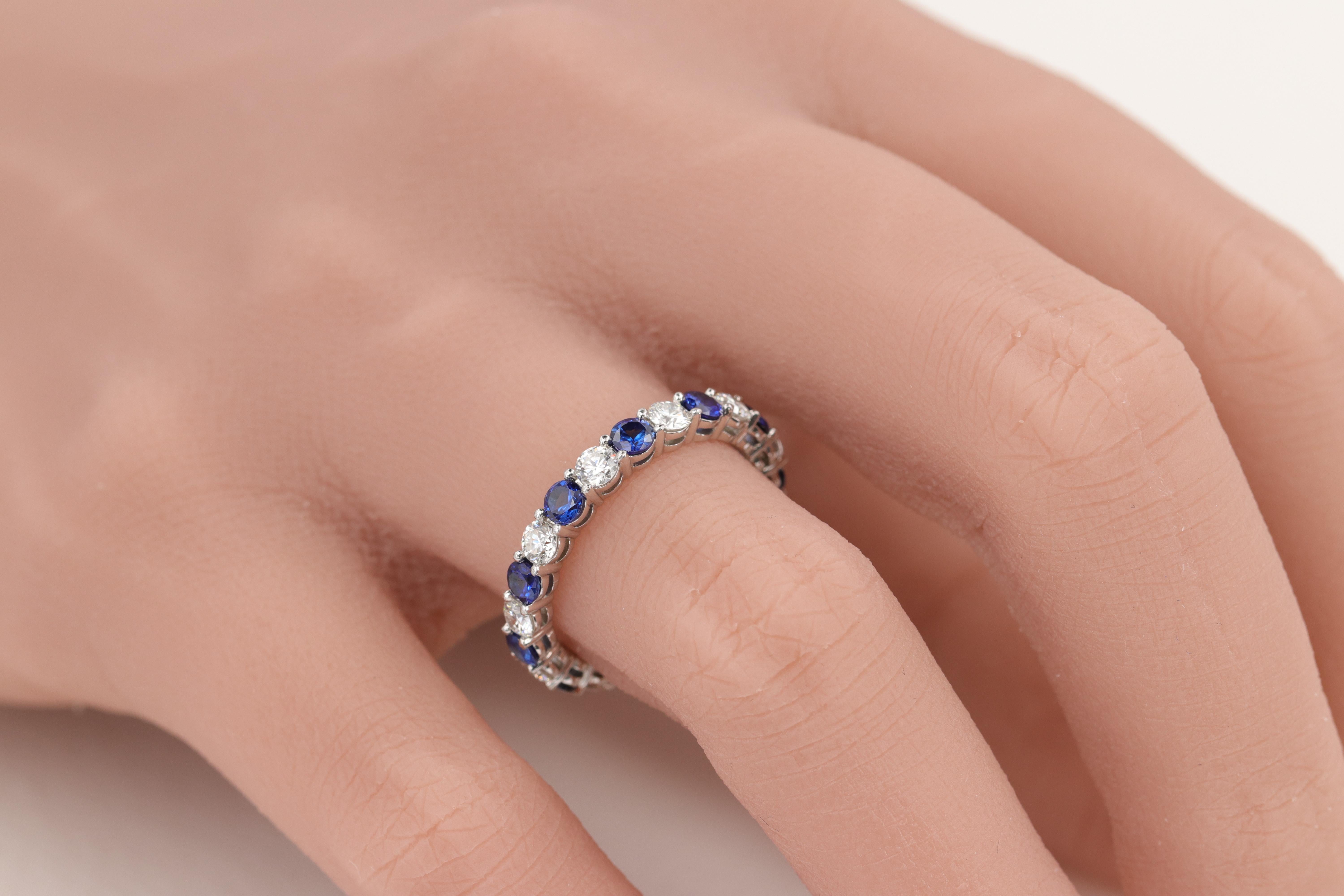 Tiffany & Co. Embrace Sapphire and Diamond Eternity Band Ring Set in Platinum 

Stones: 

Diamonds - 11 = 0.85ctw
Color - D-F
 Clarity - VS +

Sapphires - 11 = 1.10ctw
Color - Vivid Blue
Clarity - Eye Clean 

Ring: 

Metal - Platinum 
Weight - 4.6