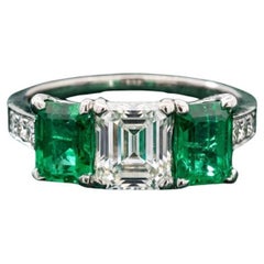 Tiffany & Co. Emerald Cut Emerald and Diamond Platinum Three Stone Ring