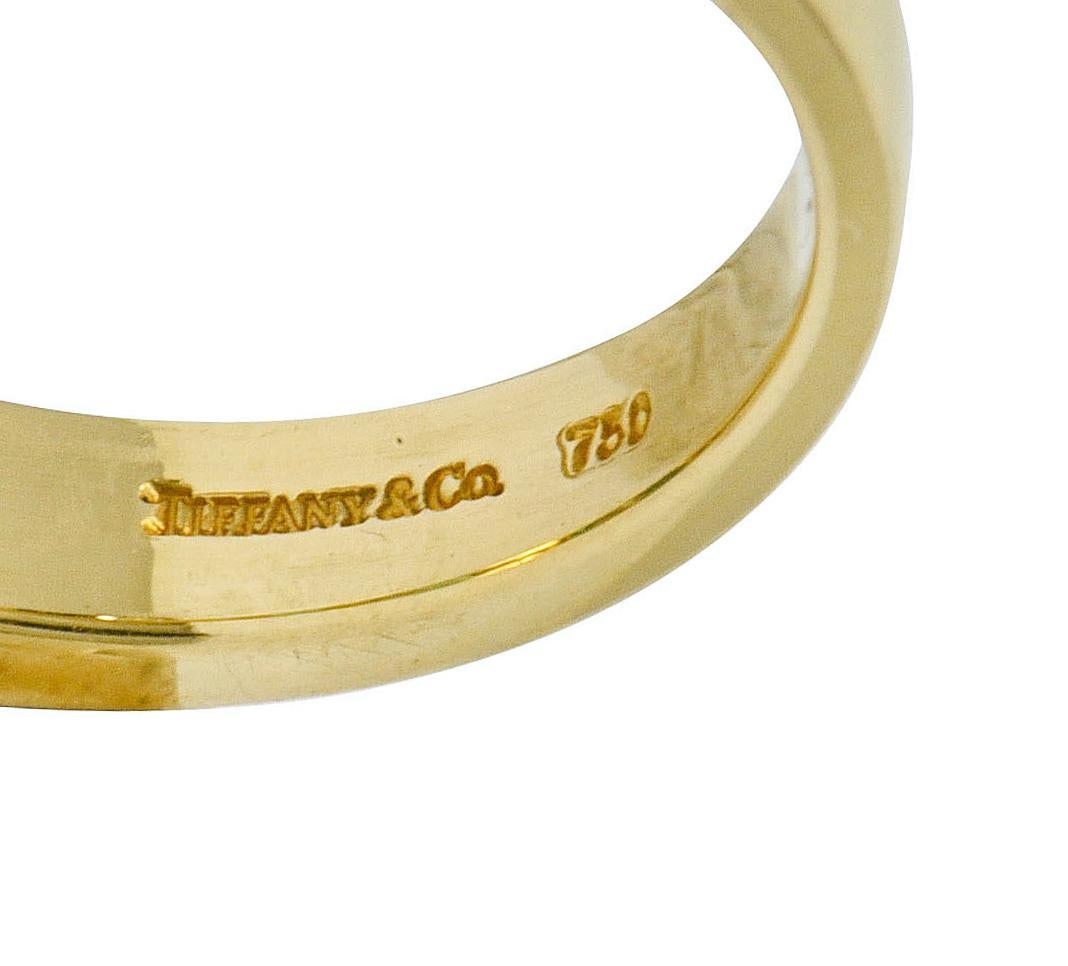 Emerald Cut Tiffany & Co. Emerald Diamond 18 Karat Gold Channel Band Ring, circa 1990