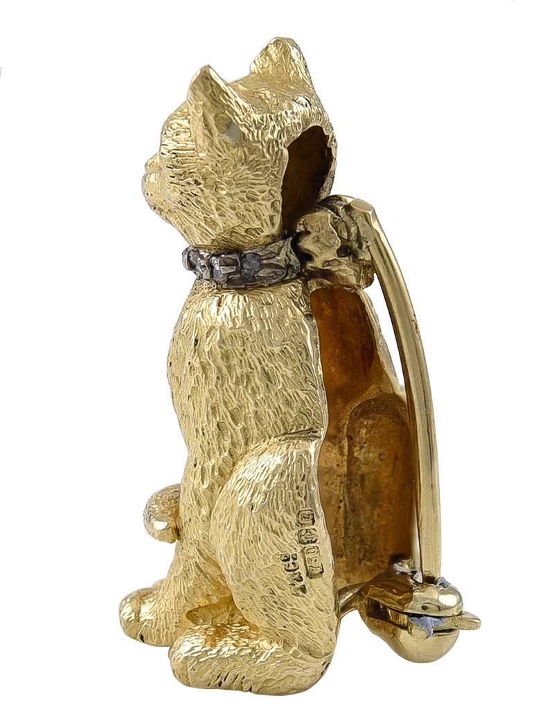 Sitting calmly and resembling Bestat, the much adored Cat Goddess of ancient Egypt and wearing a Rose Diamond collar and with her tail curled in a charming way.
On one side, only visible with a loup, are the English import marks T & Co 750 and in