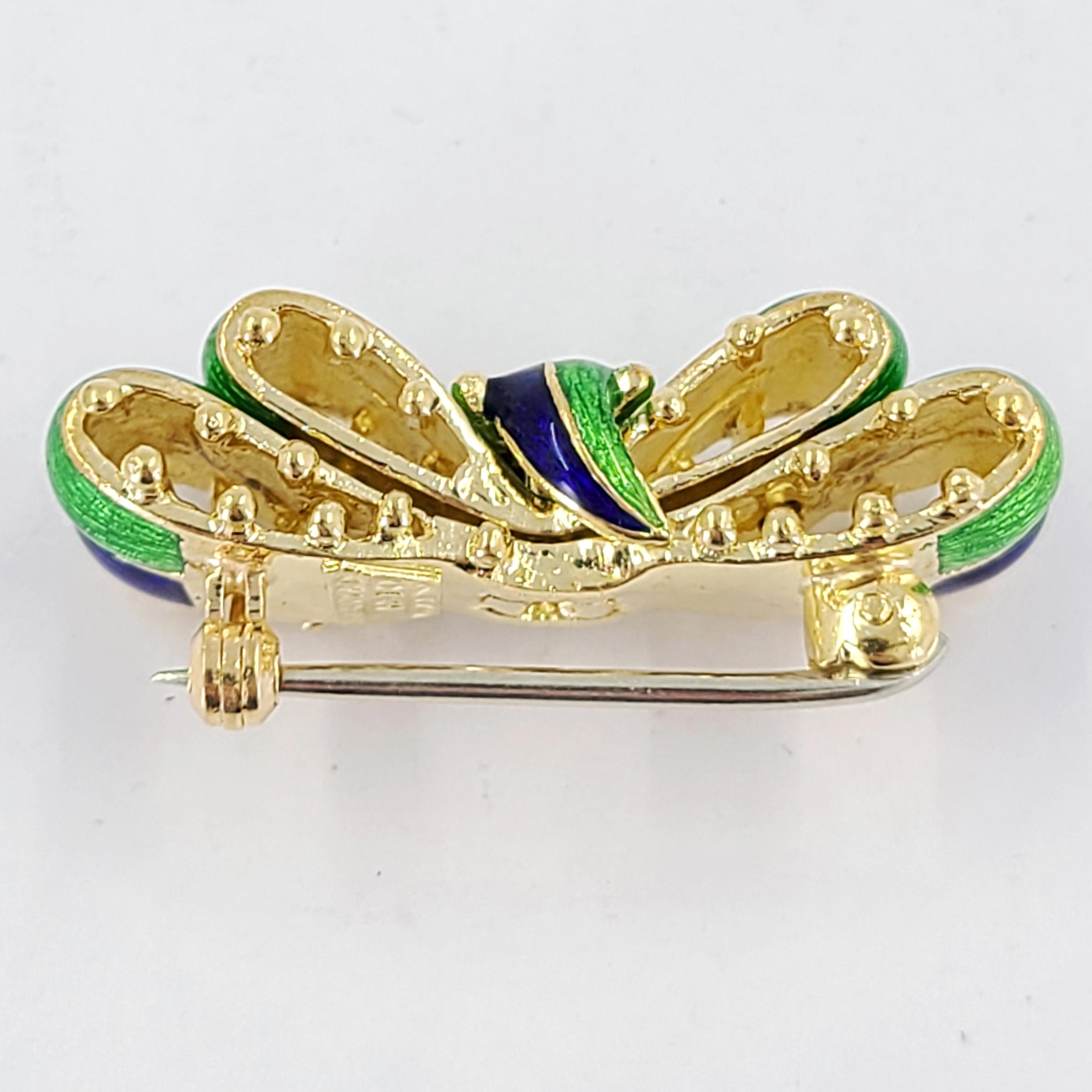 Rare Tiffany & Co. 18 Karat Yellow Gold & Multicolor Enamel Bow Brooch In Green & Blue With Rounded Bead Accents. 1.25 Inches Long. Finished Weight Is 12.8 Grams.